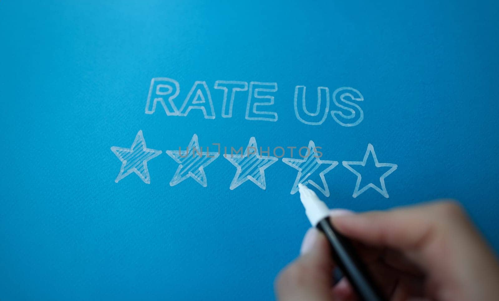 Person marker writes rate feedback to us. Customer service and social media