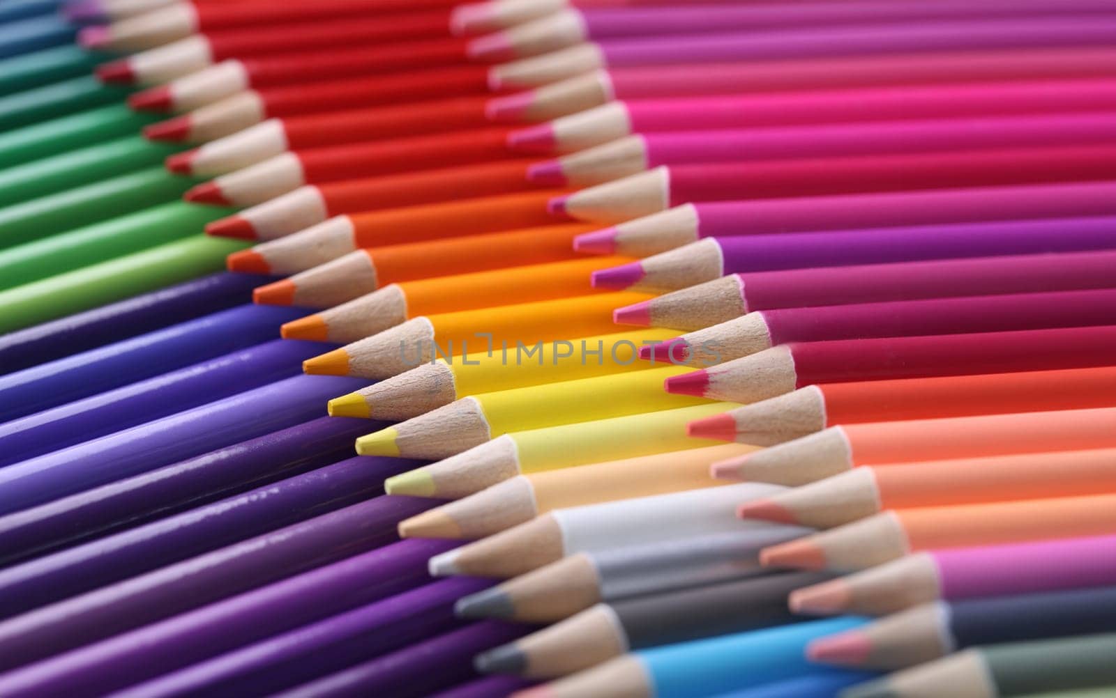 Colored pencils closeup. Collection of colored pencils in row concept