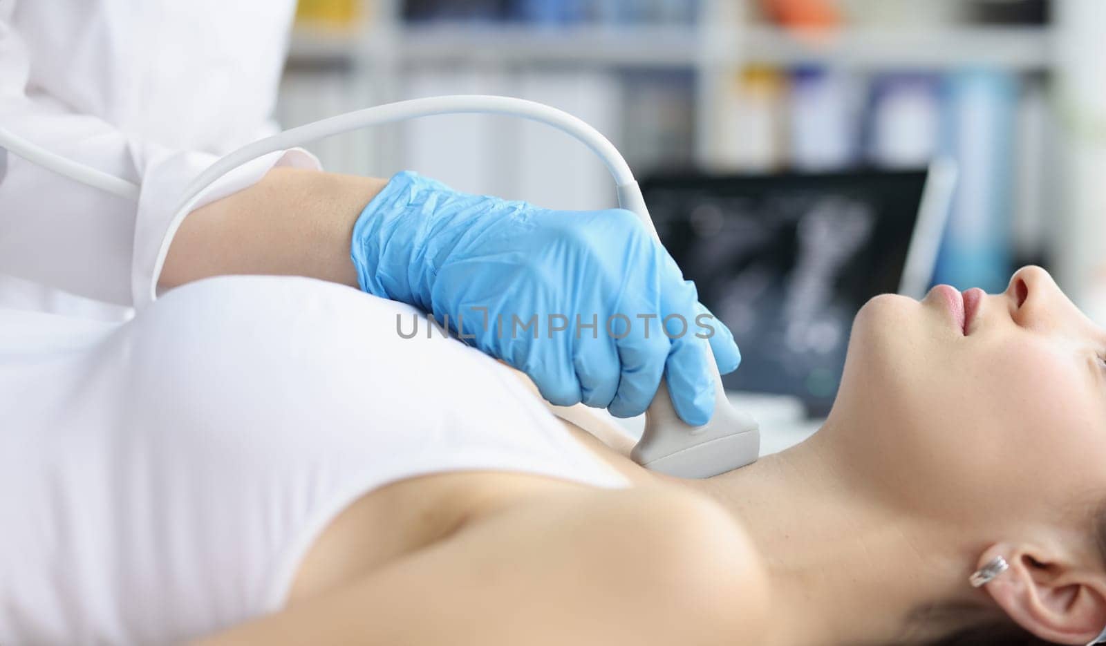 Woman receives ultrasound of thyroid gland from doctor. Thyroid hormones and thyroid gland