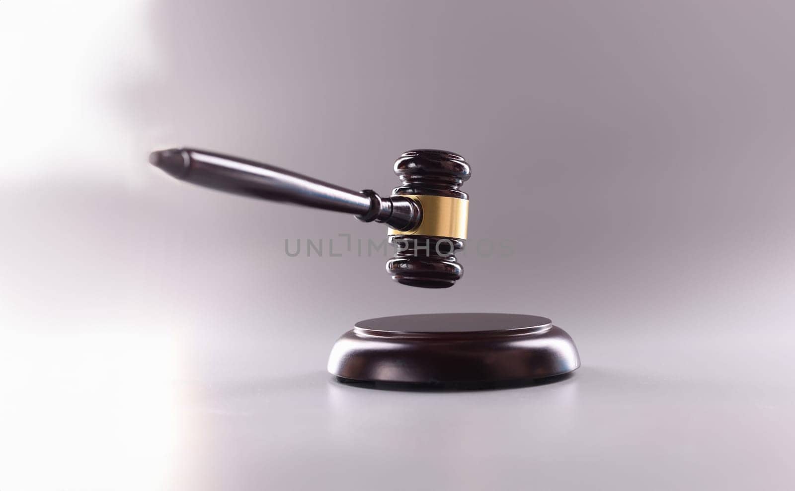 Wooden gavel for court or auction on gray background.Symbol of power and the right to perform competent actions in position of judge