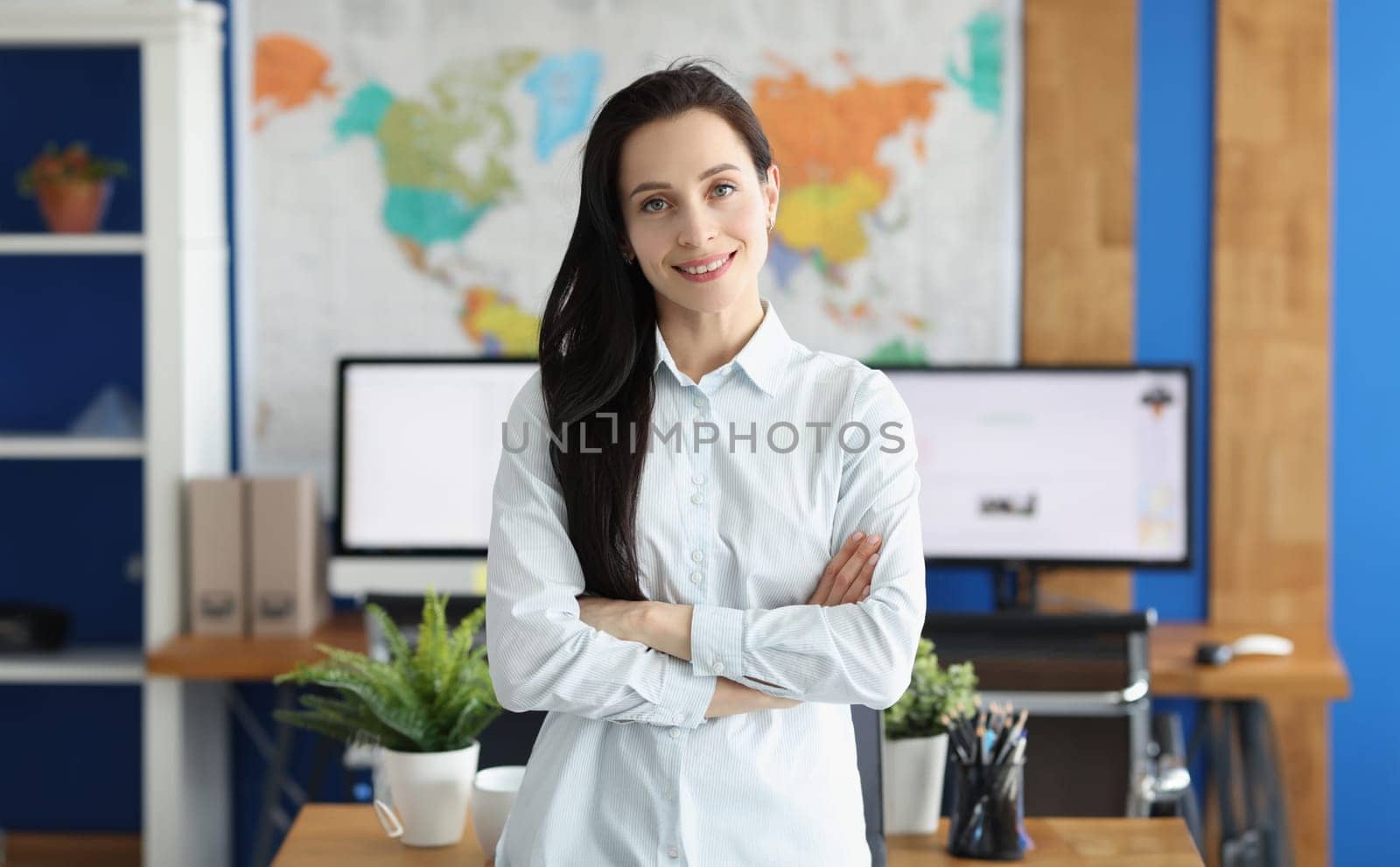 Casual business woman looks happy and smiling in office. Business consultant manager workplace