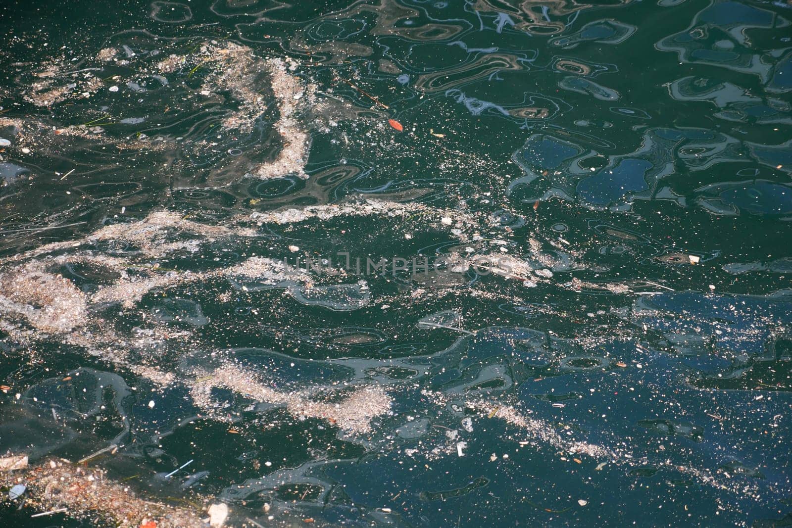 Sea water pollution with garbage.