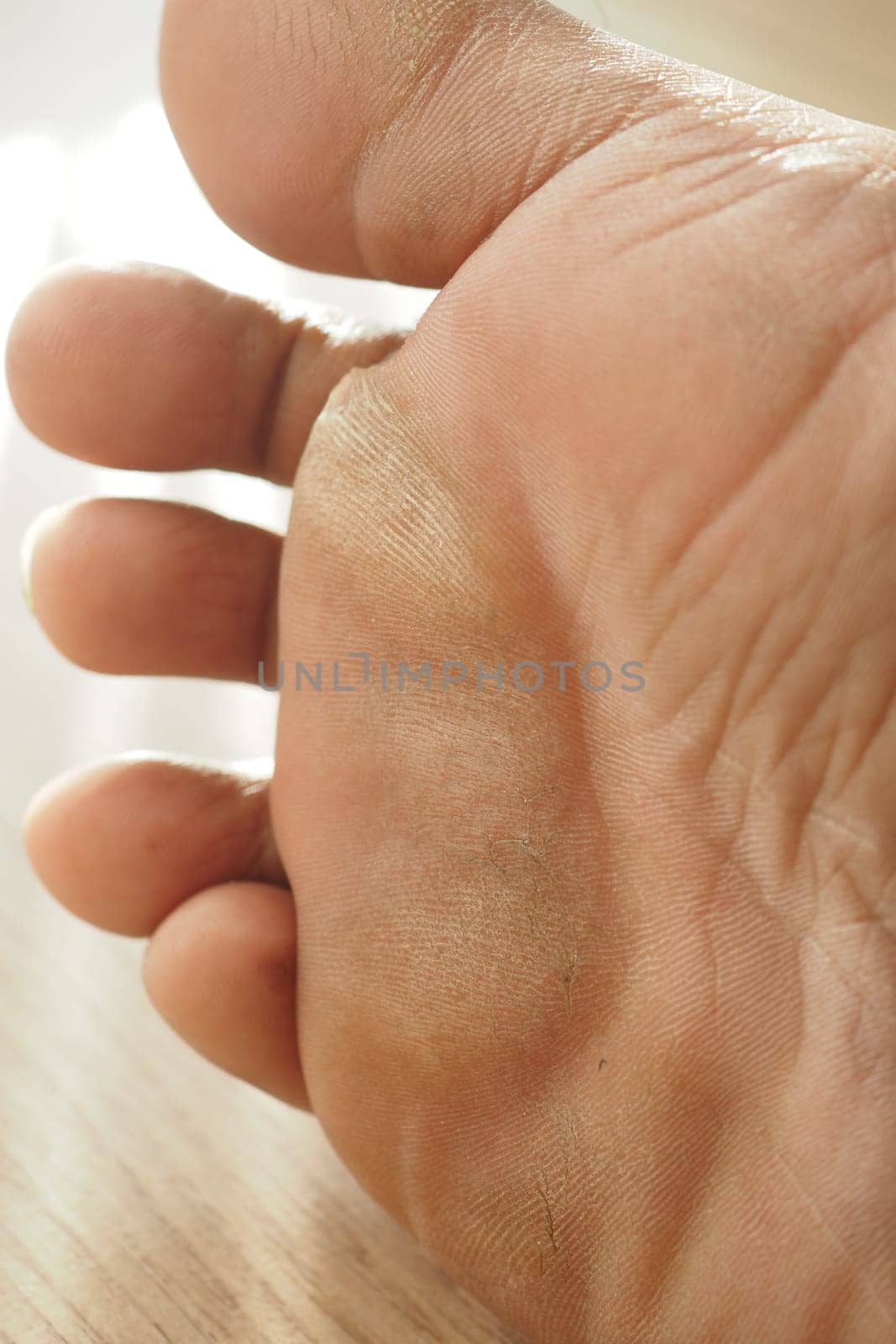 close up of young man dry feet on bed ,