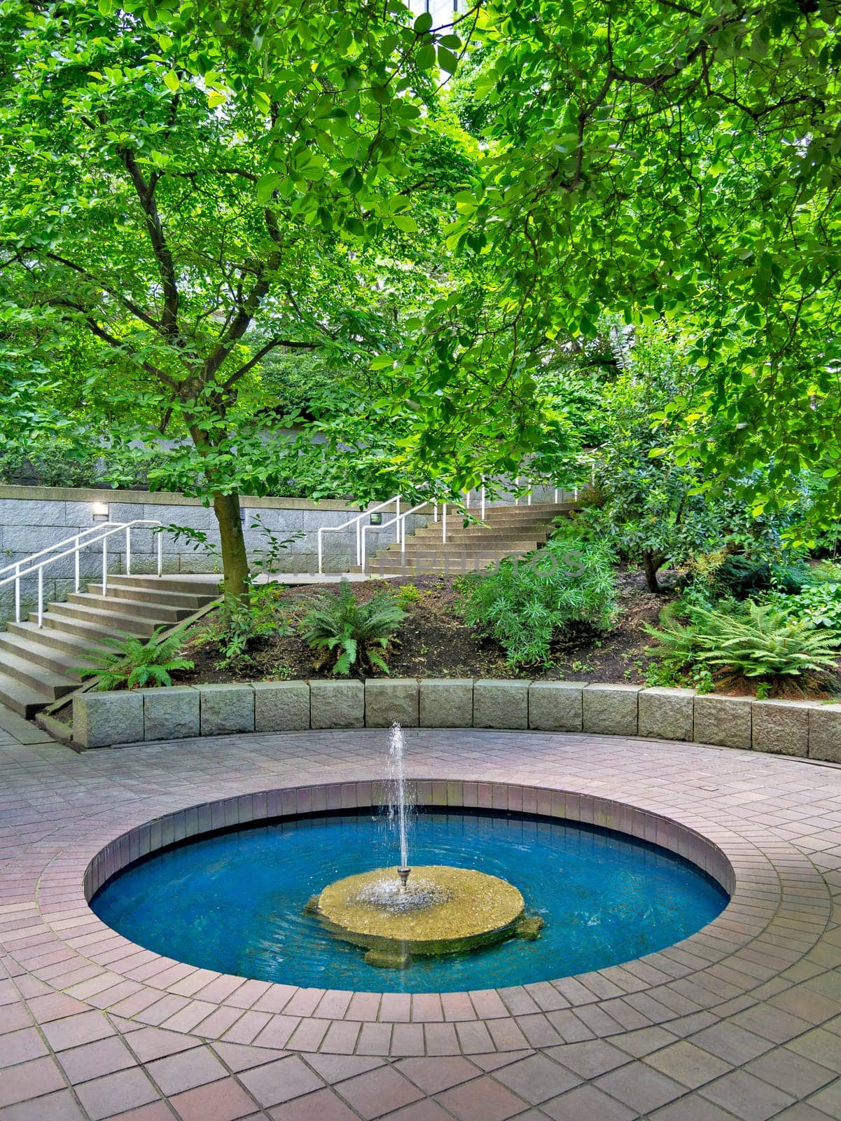 Small inner yard of residential area with fountain in downtown of Vancouver.