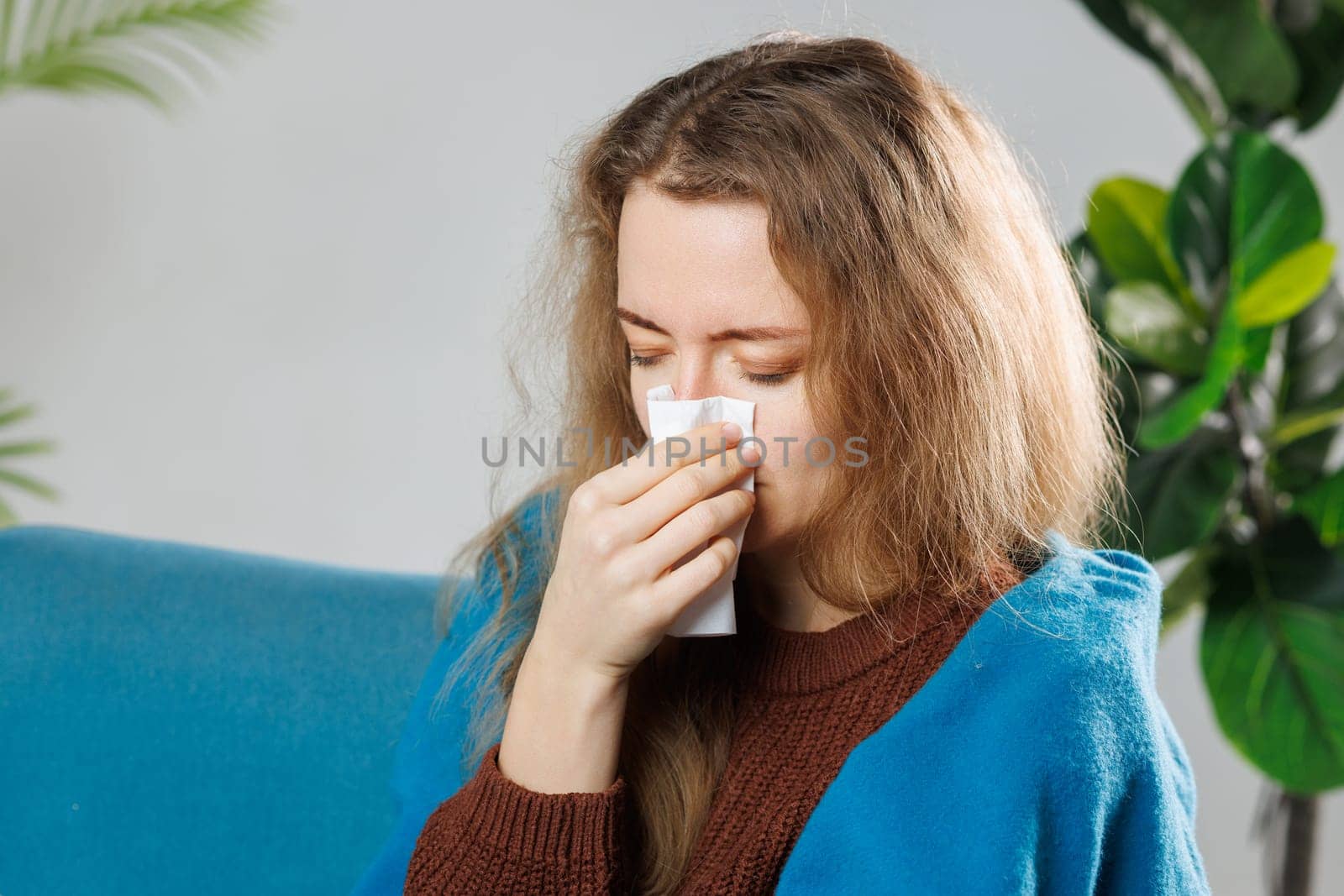 Cold And Flu. Portrait Of Ill Woman Caught Cold, Feeling Sick And Sneezing In Paper Wipe. Closeup Of Beautiful Unhealthy Girl Covered In Blanket Wiping Nose. Healthcare Concept.
