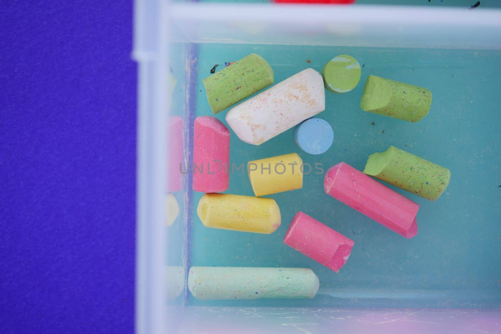 Vibrant chalk pieces submerged in water are perfect for art and educational activities
