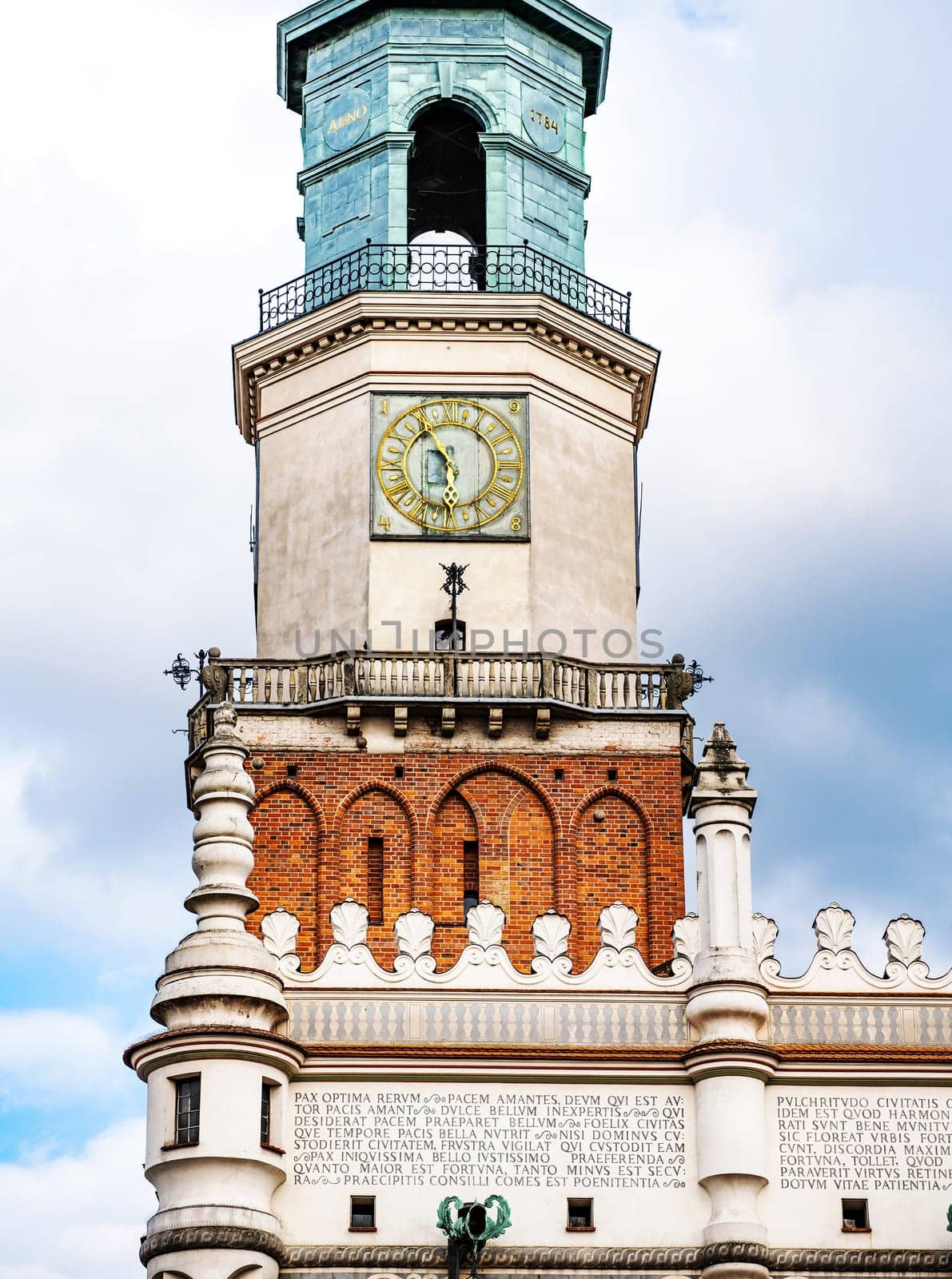 Poznan, Poland - 04 February 2024: Old architecture tower with clock on the old market square in Poznan in Poland.