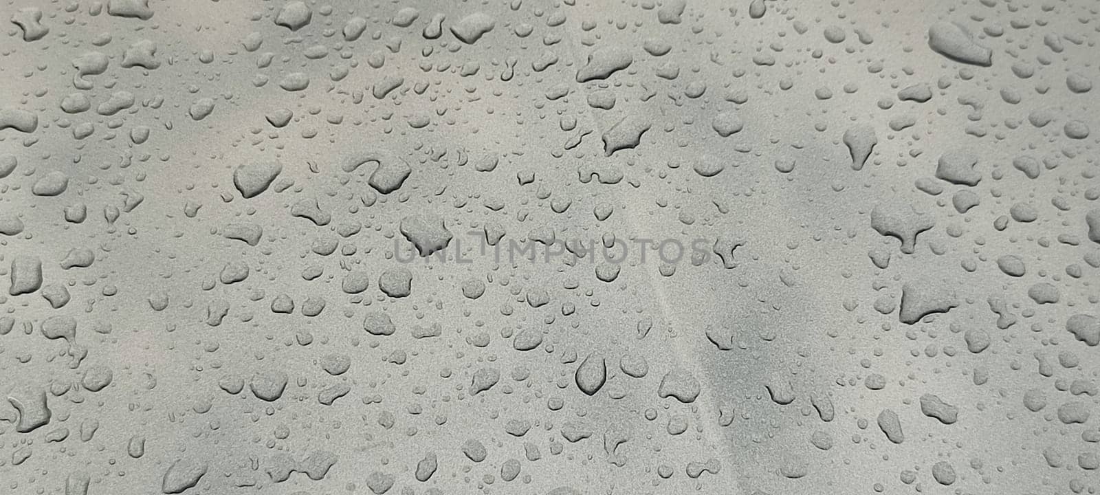 raindrops on gray background water weather. High quality photo