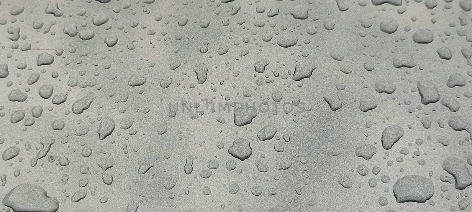 raindrops on gray background water weather. High quality photo