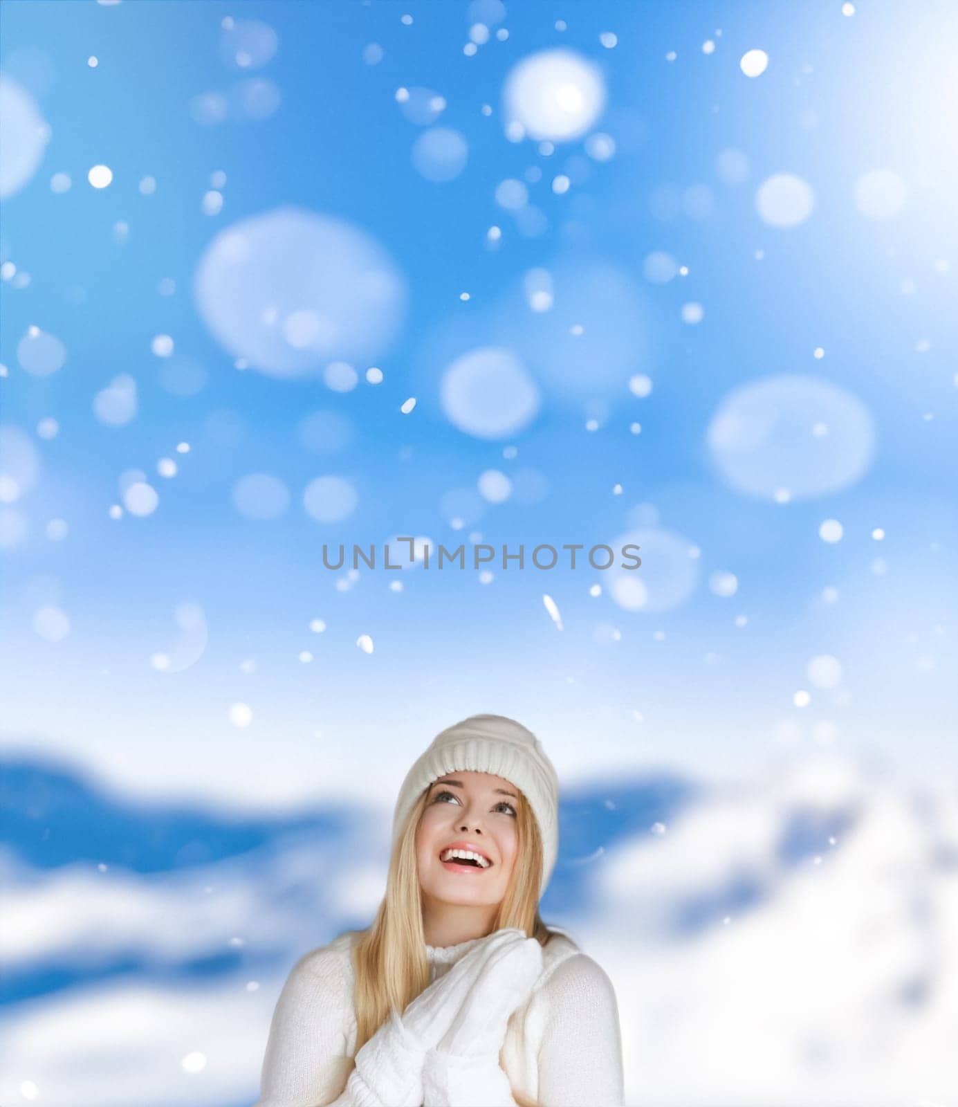 Blonde woman wearing warm mittens, knitted beanie hat and jumper, winter snow nature background with copyspace fashion and lifestyle idea