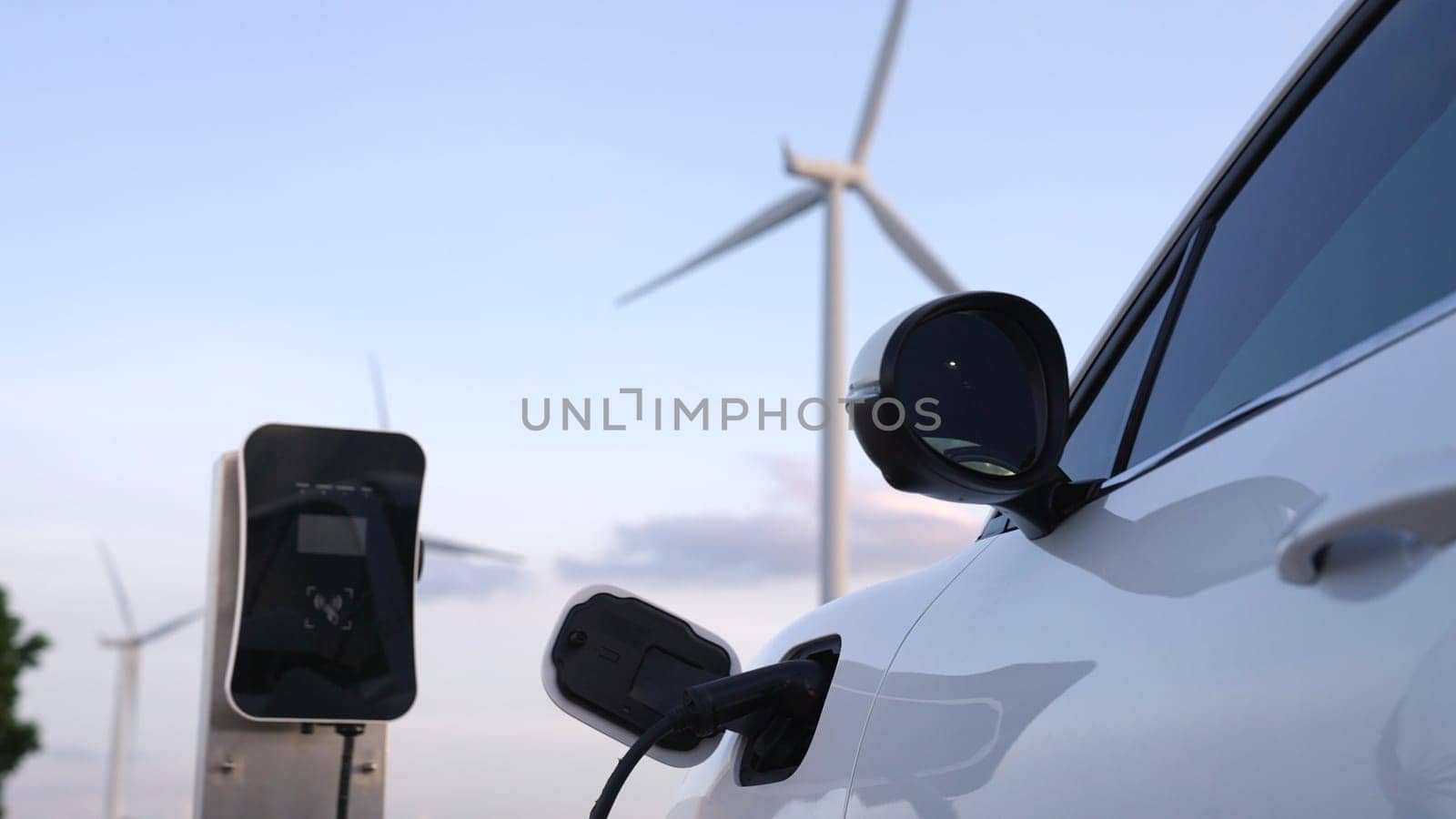 Progressive combination of EV car, charging station and wind turbine. by biancoblue