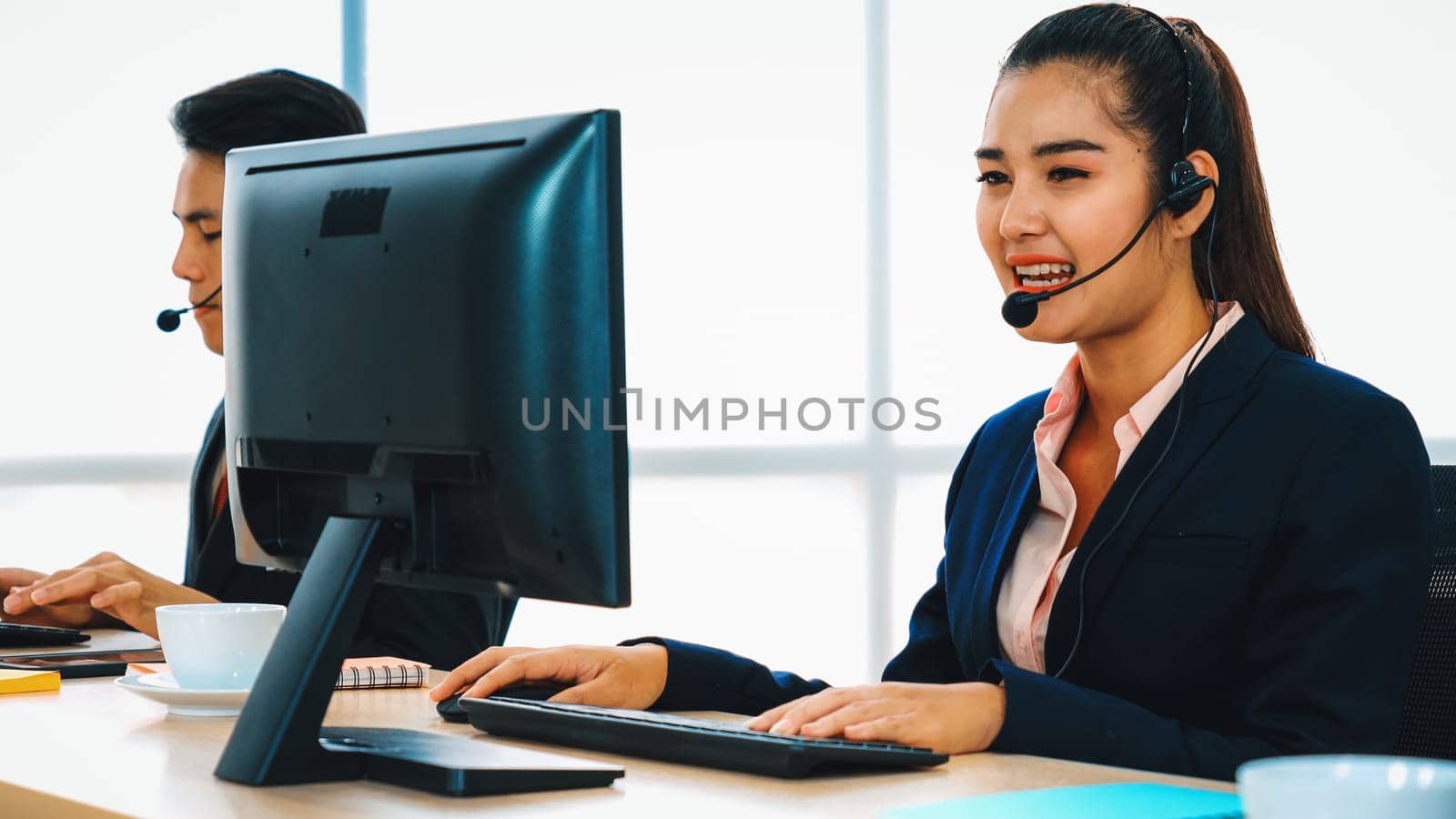 Business people wearing headset working in office Jivy by biancoblue