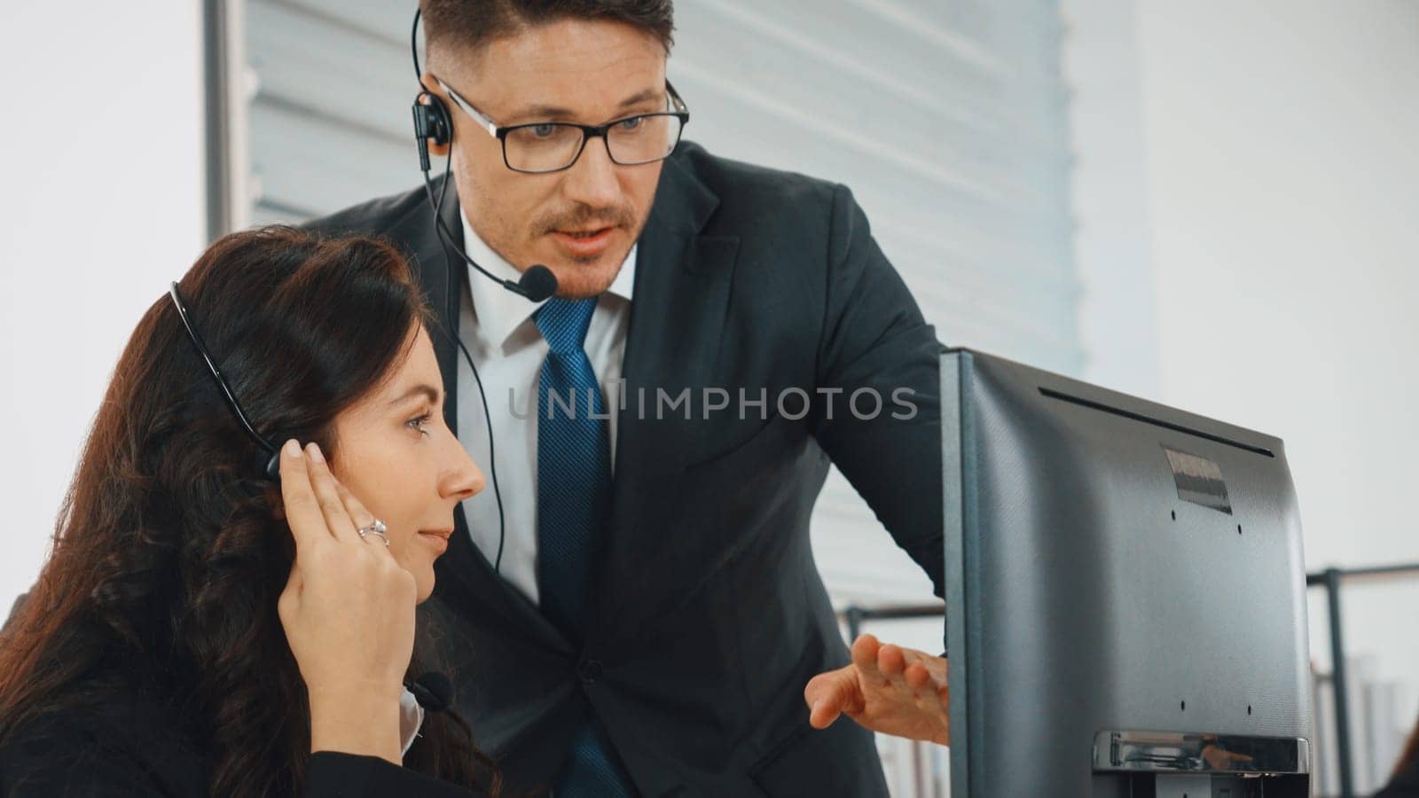 Business people wearing headset working in office Jivy by biancoblue