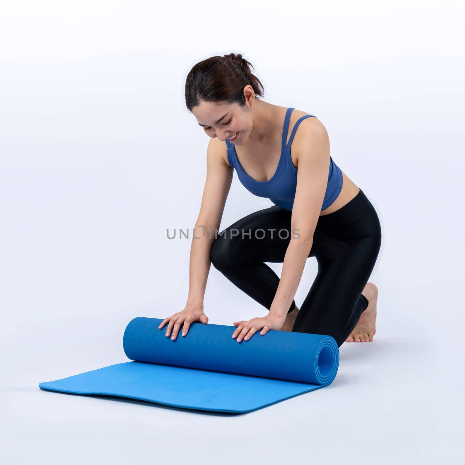 Young attractive asian woman portrait in sportswear with exercising mat Vigorous by biancoblue
