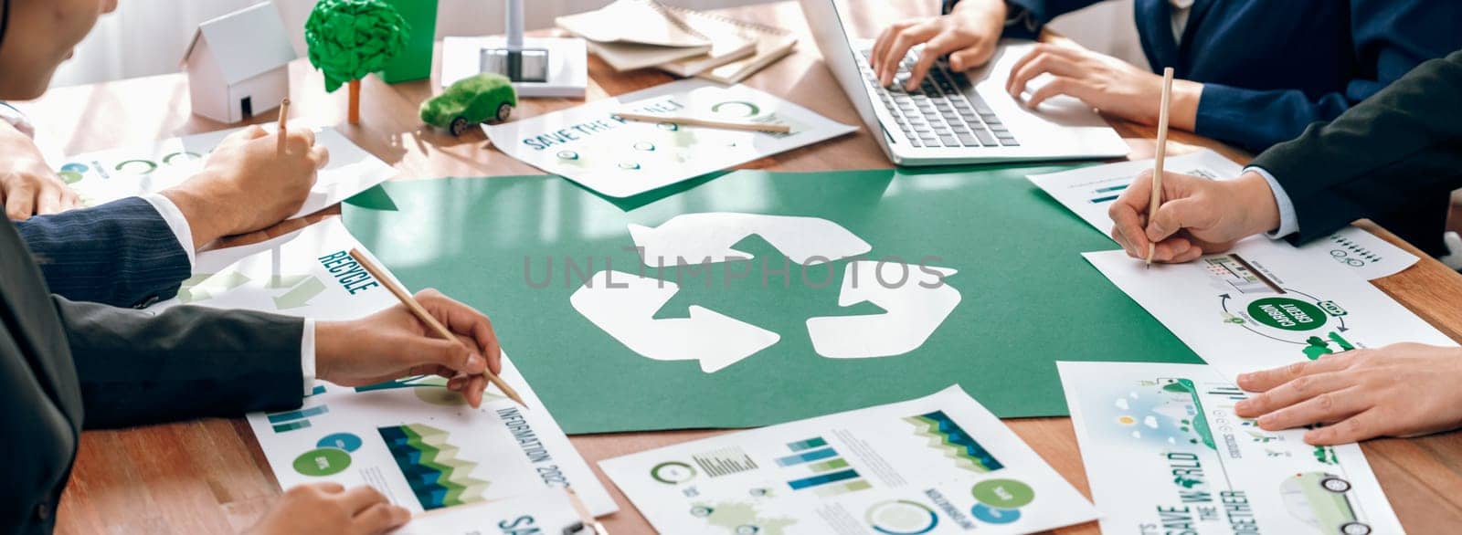 Group of business people planning and discussing on recycle reduce reuse policy symbol in office meeting room. Green business company with eco-friendly waste management regulation concept.Trailblazing