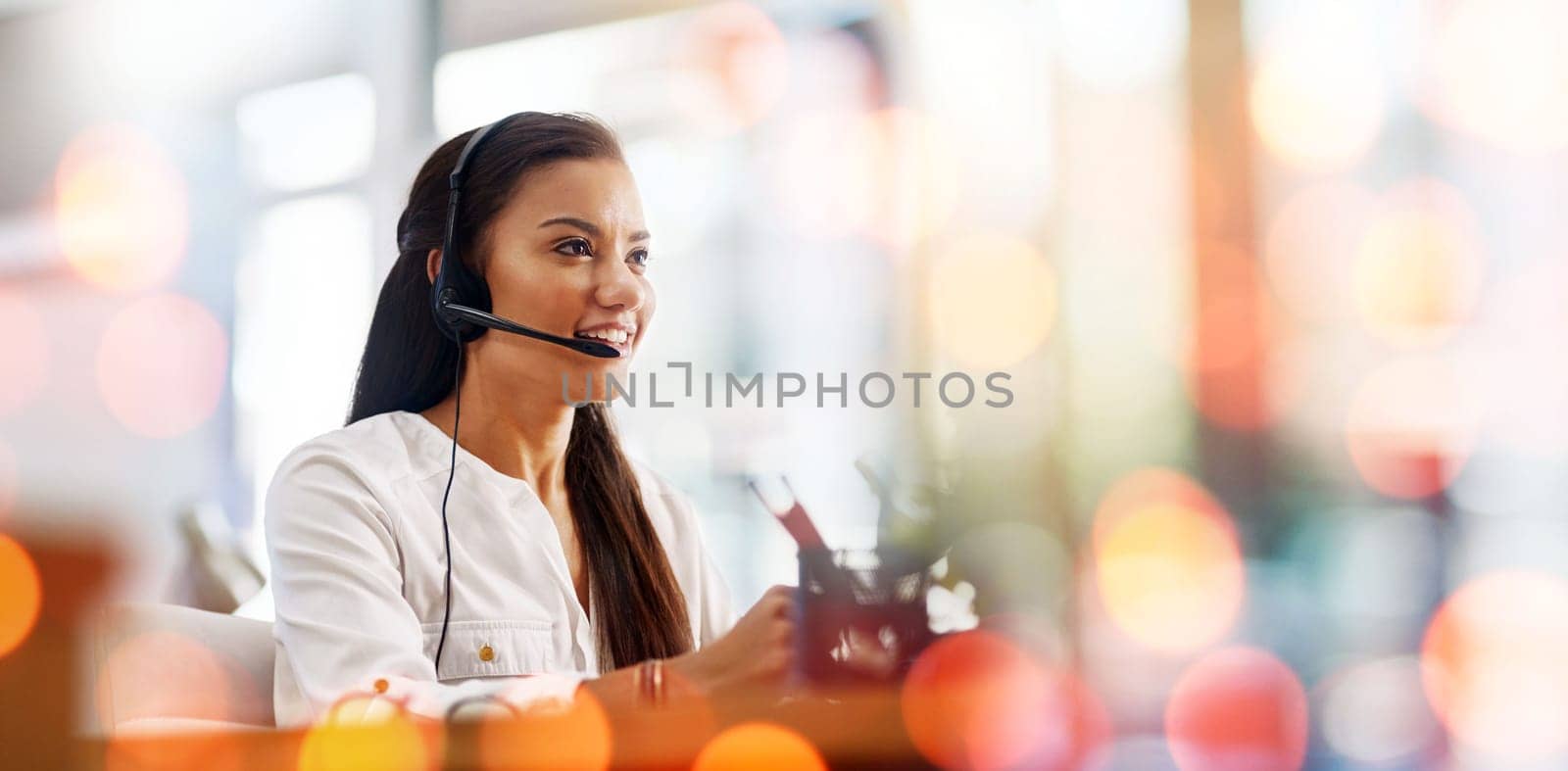 Call centre, woman and headset with smile or customer support, bokeh and overlay in mockup. Happy agent, contact us and communication or faq, support and telemarketing or crm, consulting at help desk by YuriArcurs