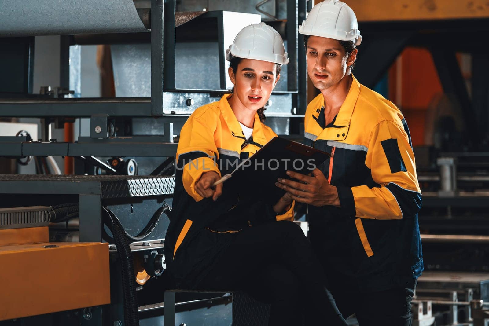 Professional quality control inspector conduct safety inspection on steel machinery and manufacturing process. Factory engineer or operator make optimization in heavy industry facility. Exemplifying