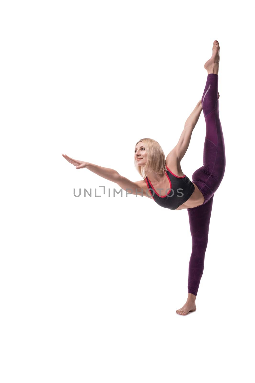 Blonde in sportswear doing yoga full-length isolated shot on white