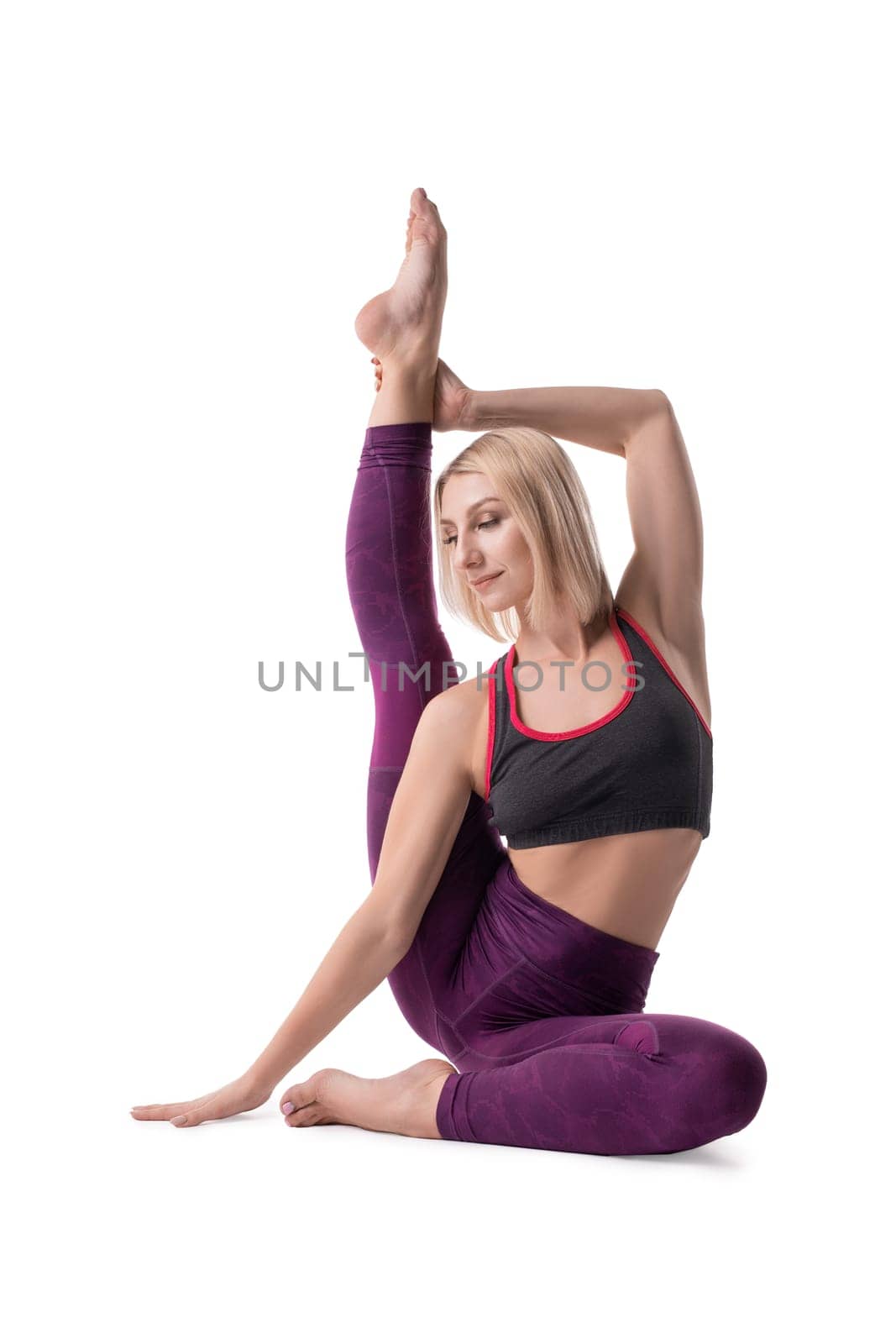 Woman in sportswear doing yoga isolated shot on white