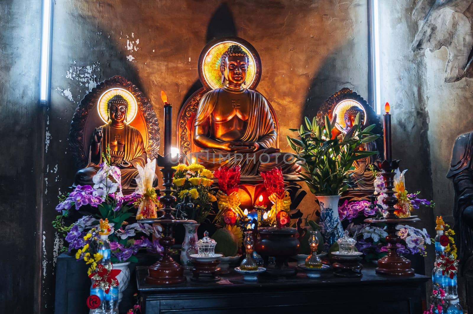 Buddha statues inside temple at the Long Son Buddhist Pagoda in Nha Trang in Vietnam