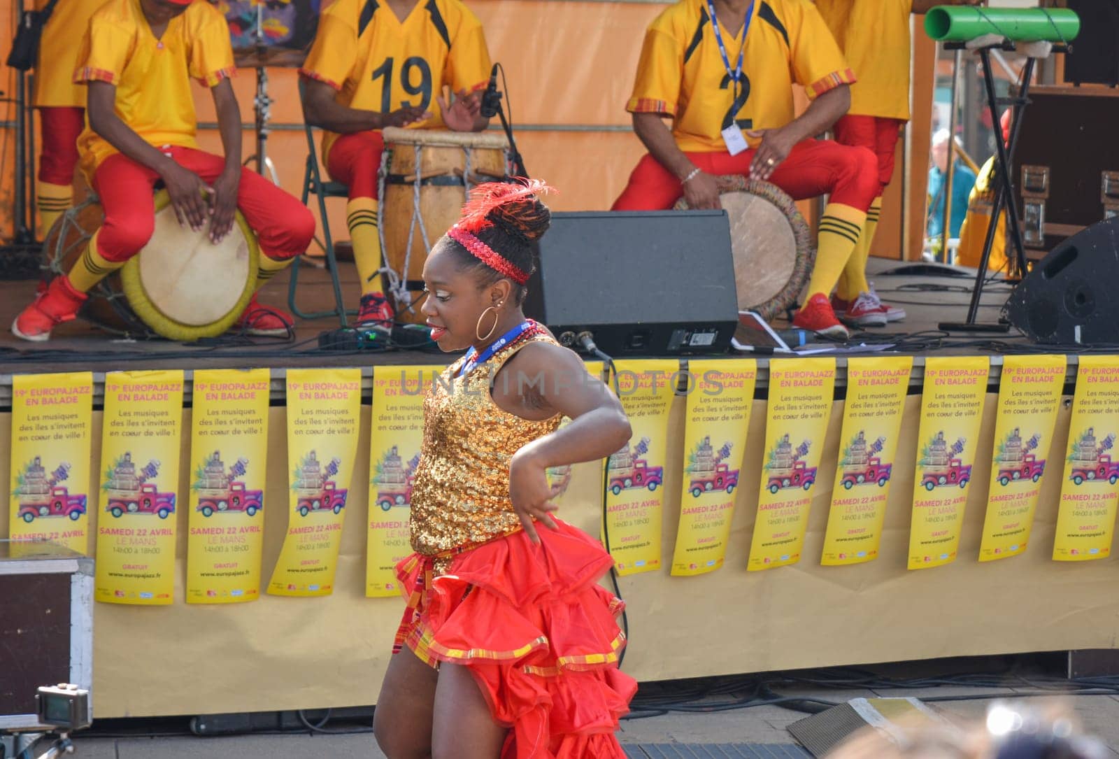 LE MANS, FRANCE - APRIL 22, 2017: Festival Evropa jazz Musicians playing drums and dancers dance Caribbean dance in costumes