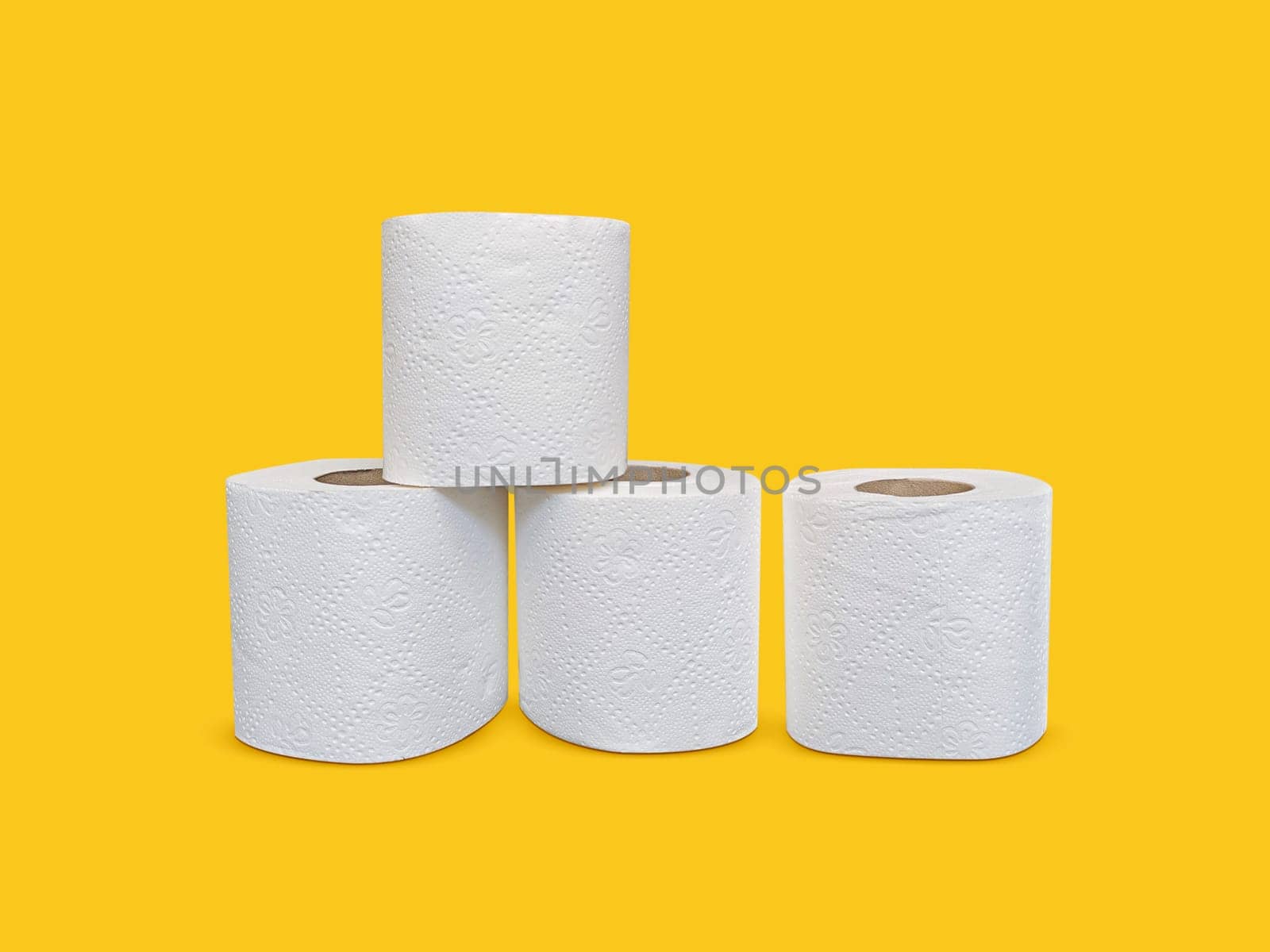 Toilet paper roll on yellow background