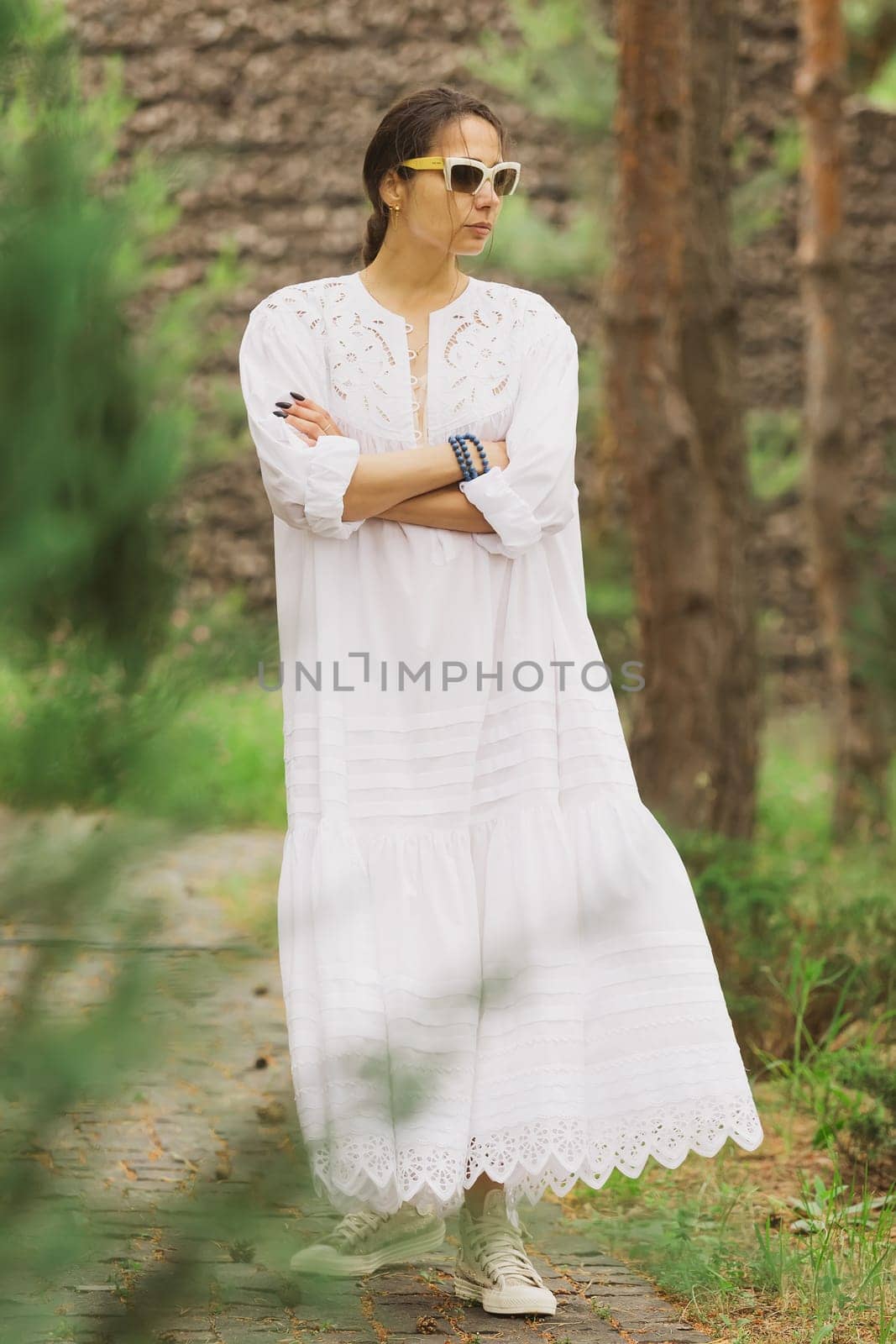 beautiful young woman in elegant dress outdoors by sarymsakov