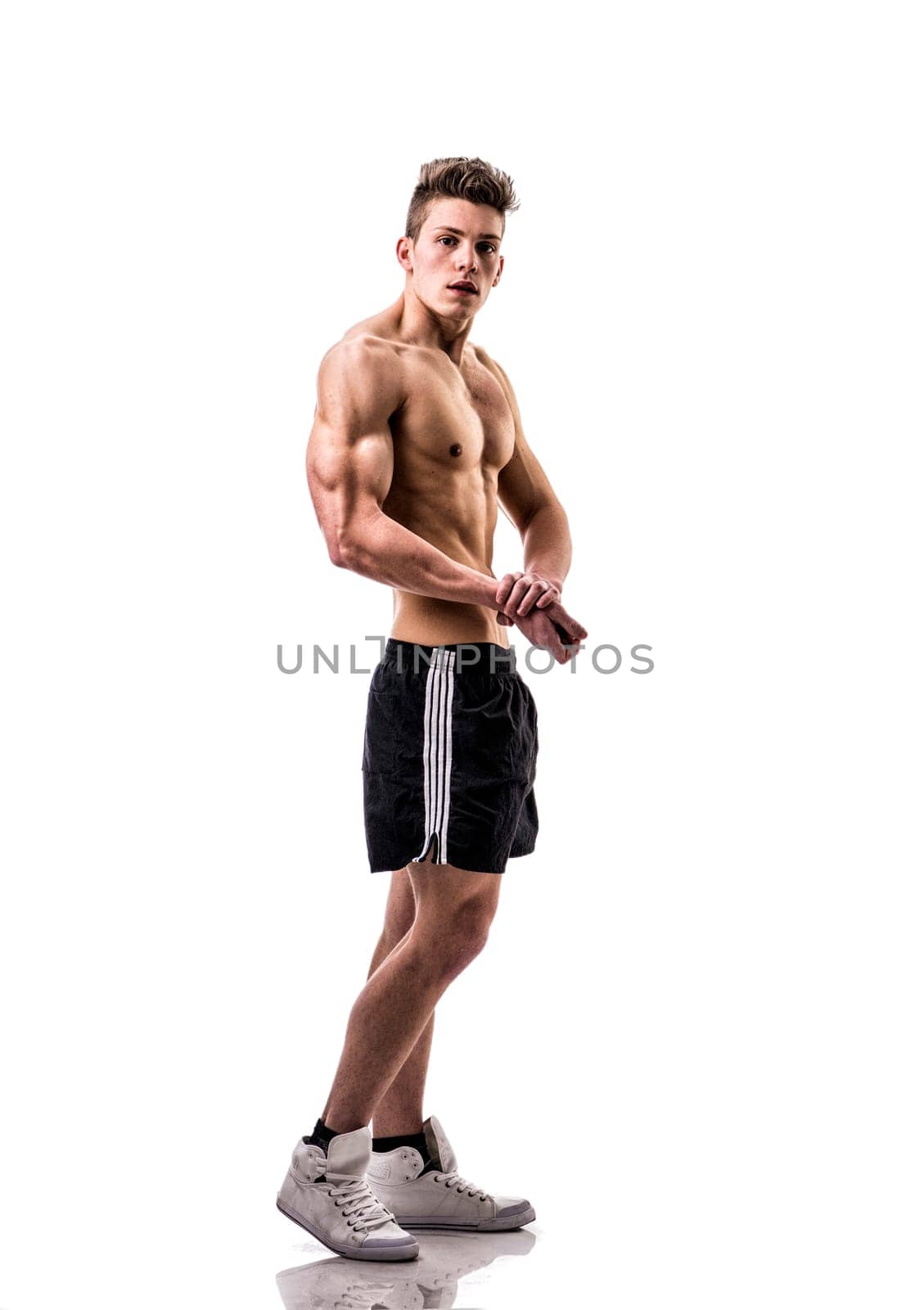 Photo of a shirtless young man posing for a picture by artofphoto