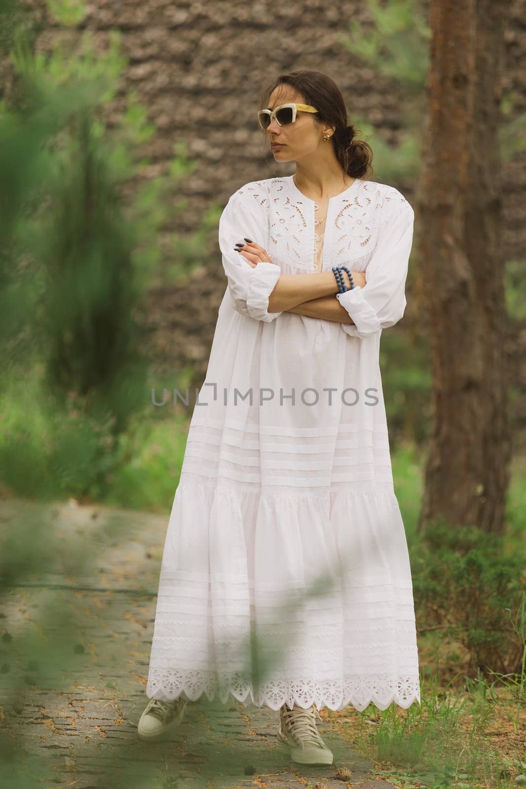 beautiful young woman in elegant dress outdoors.