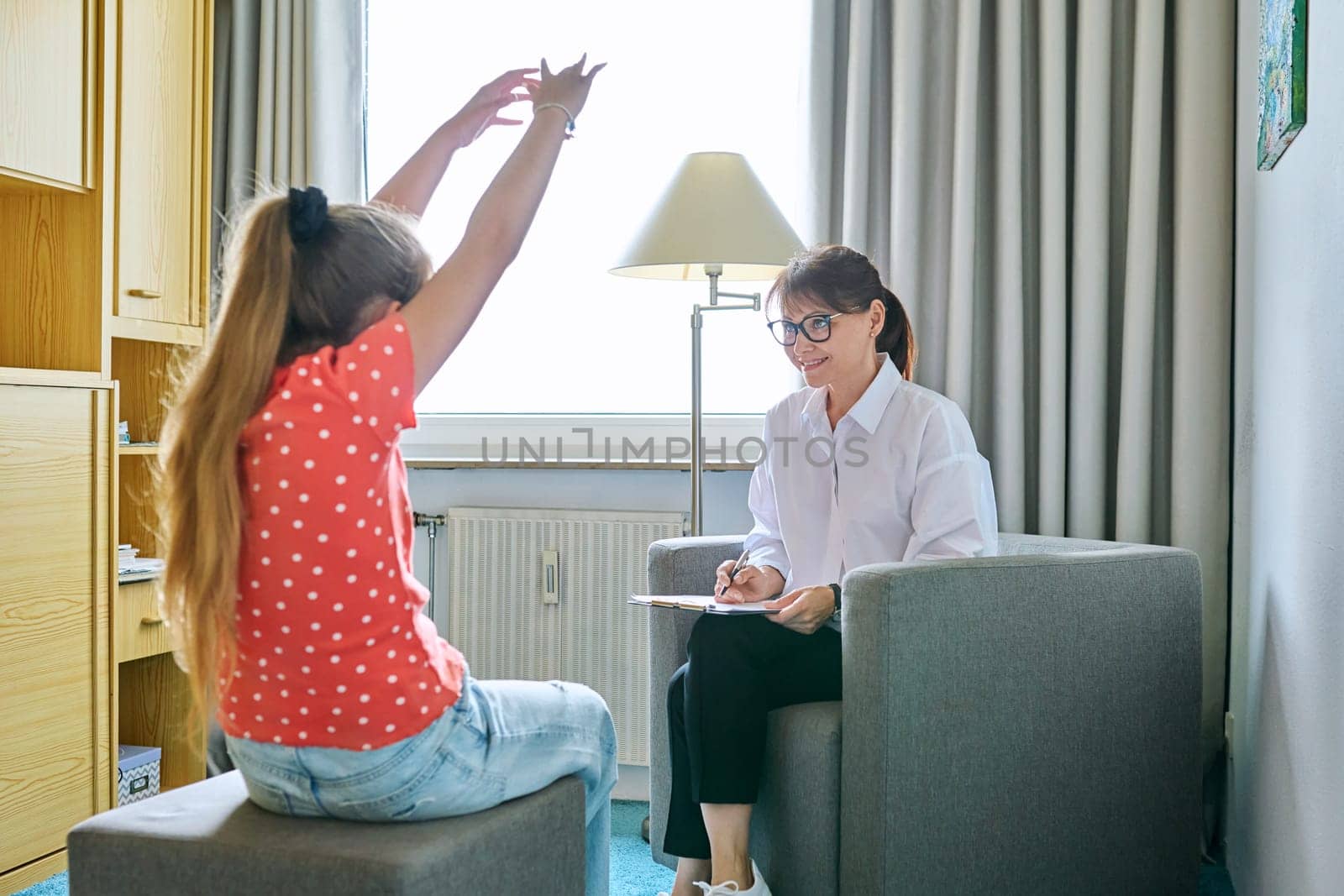 Child family psychology, female psychologist psychiatrist therapist social worker talking to girl child. Mental health of children psychiatry professional psychological support counseling childhood