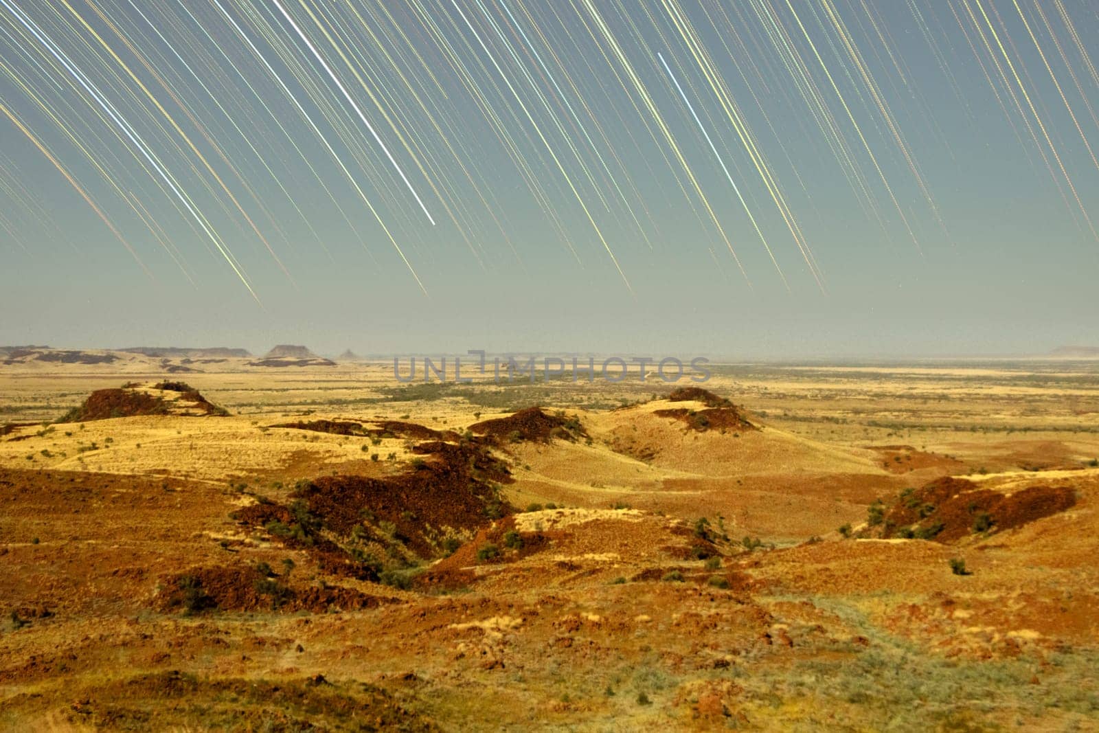 Star trails over unusual rock formation landscape by StefanMal