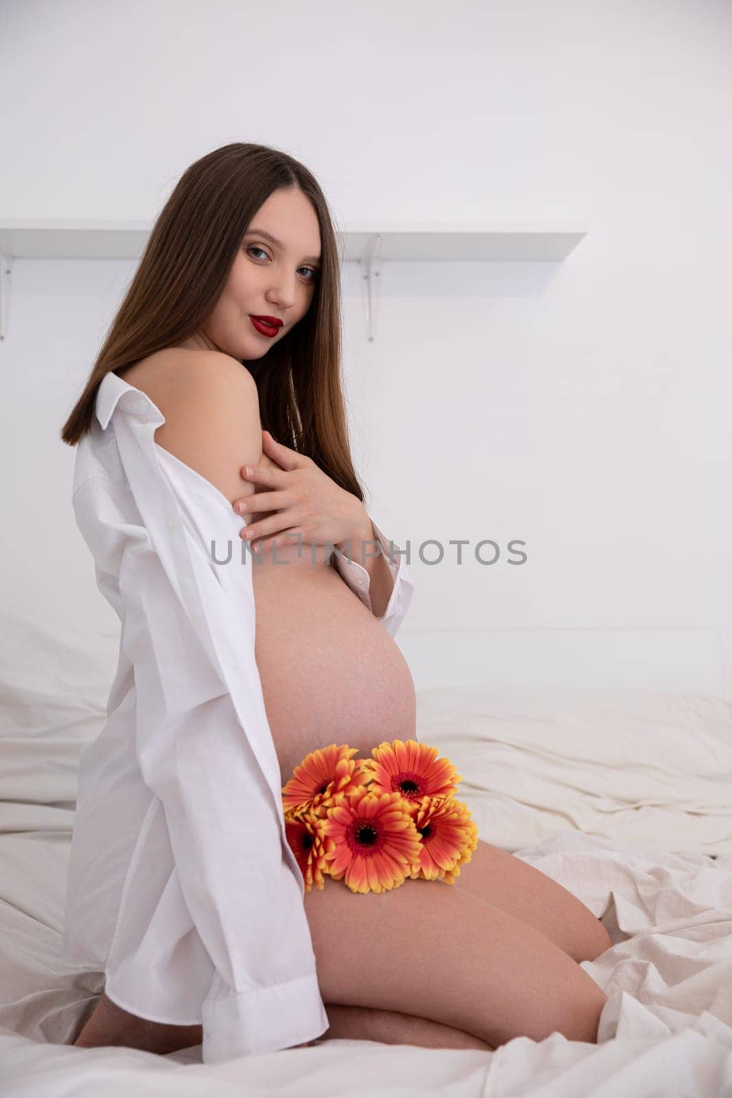 A stunning maternity shoot that beautifully showcases the natural beauty intertwined with exquisite floral elements