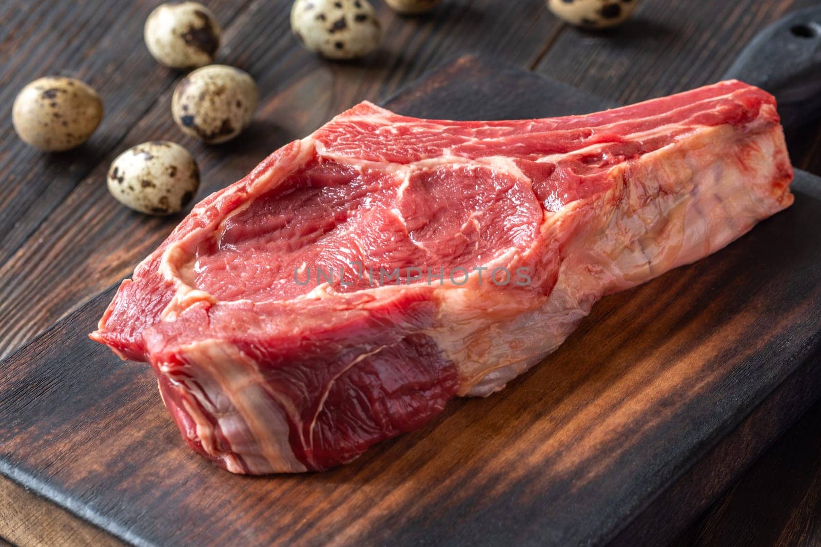 Fresh, high-quality cowboy steak with perfect marbling, ideal for grilling or pan-searing