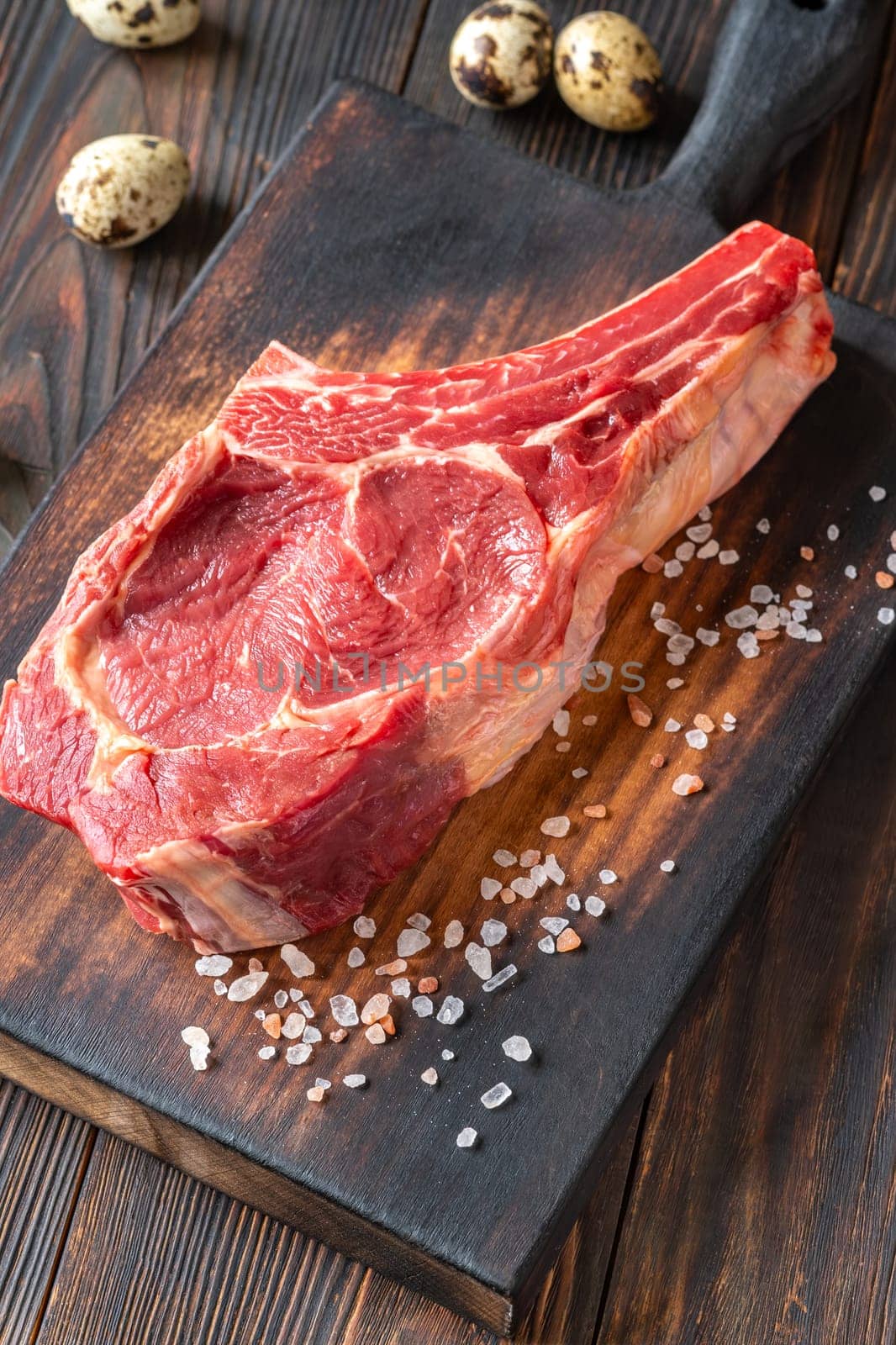 Fresh, high-quality cowboy steak with perfect marbling, ideal for grilling or pan-searing