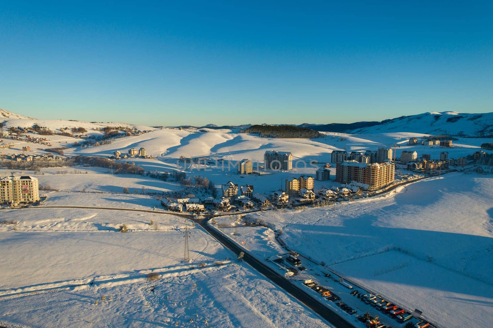 New buildings and urbanisation of Zlatibor mountain.Panoramic aerial view of Zlatibor town and clear sky over Zlatibor Mountain at winter sunset, Cajetina, Serbia.