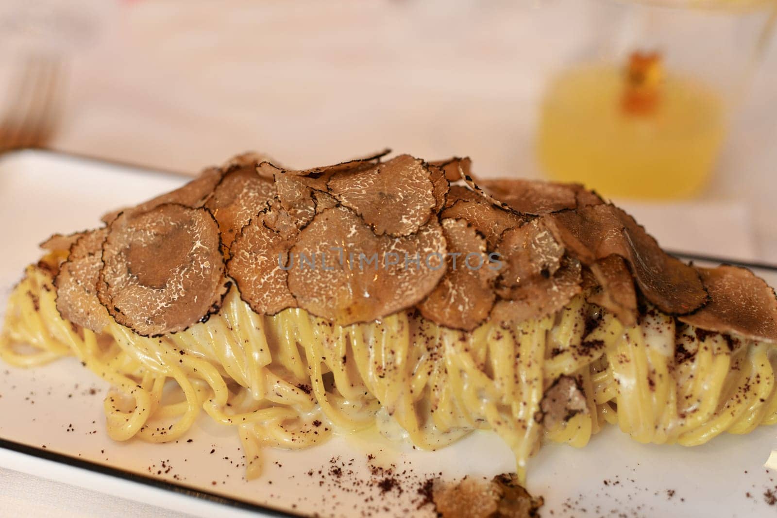 Italian pasta with truffle mushrooms in a restaurant