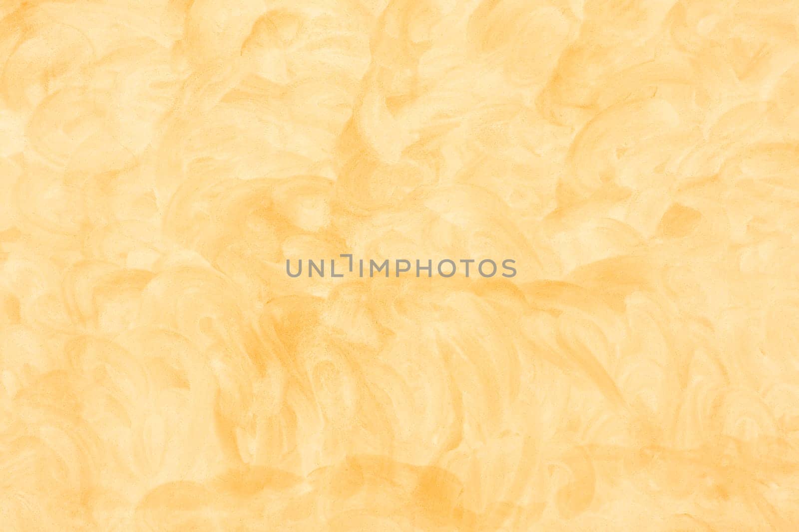 The texture of a yellow cement as a background by Gamjai