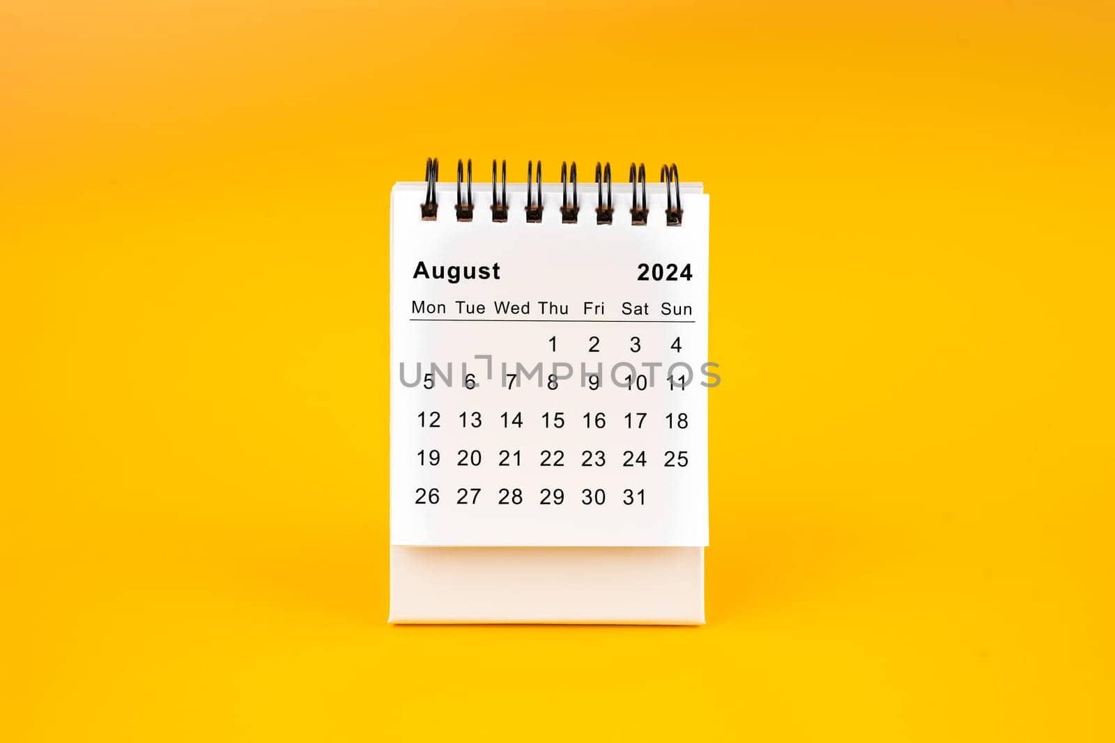 The White clean August desk calendar for 2024 year on yellow background. by Gamjai
