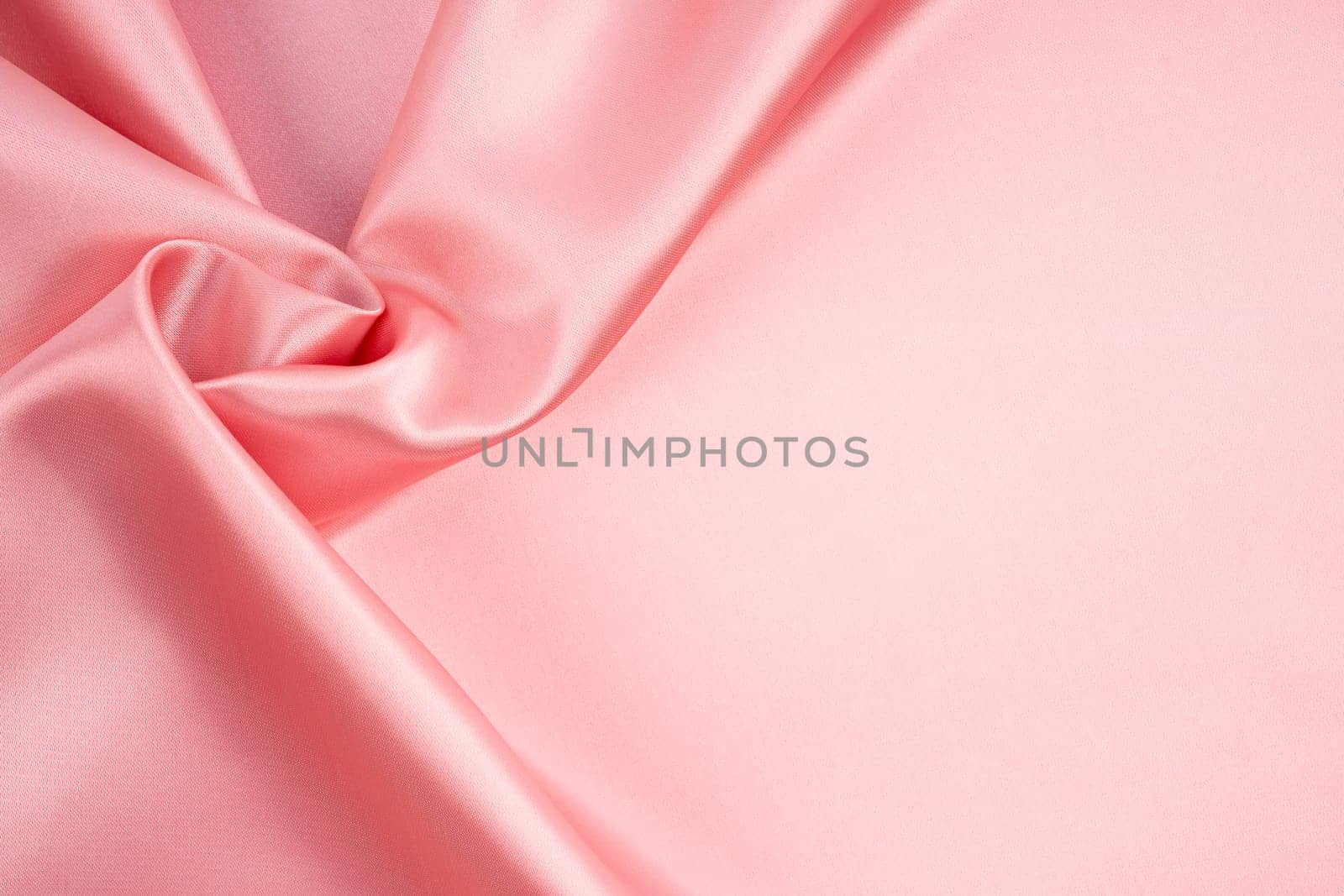 Rose Gold silk satin fabric texture as background.