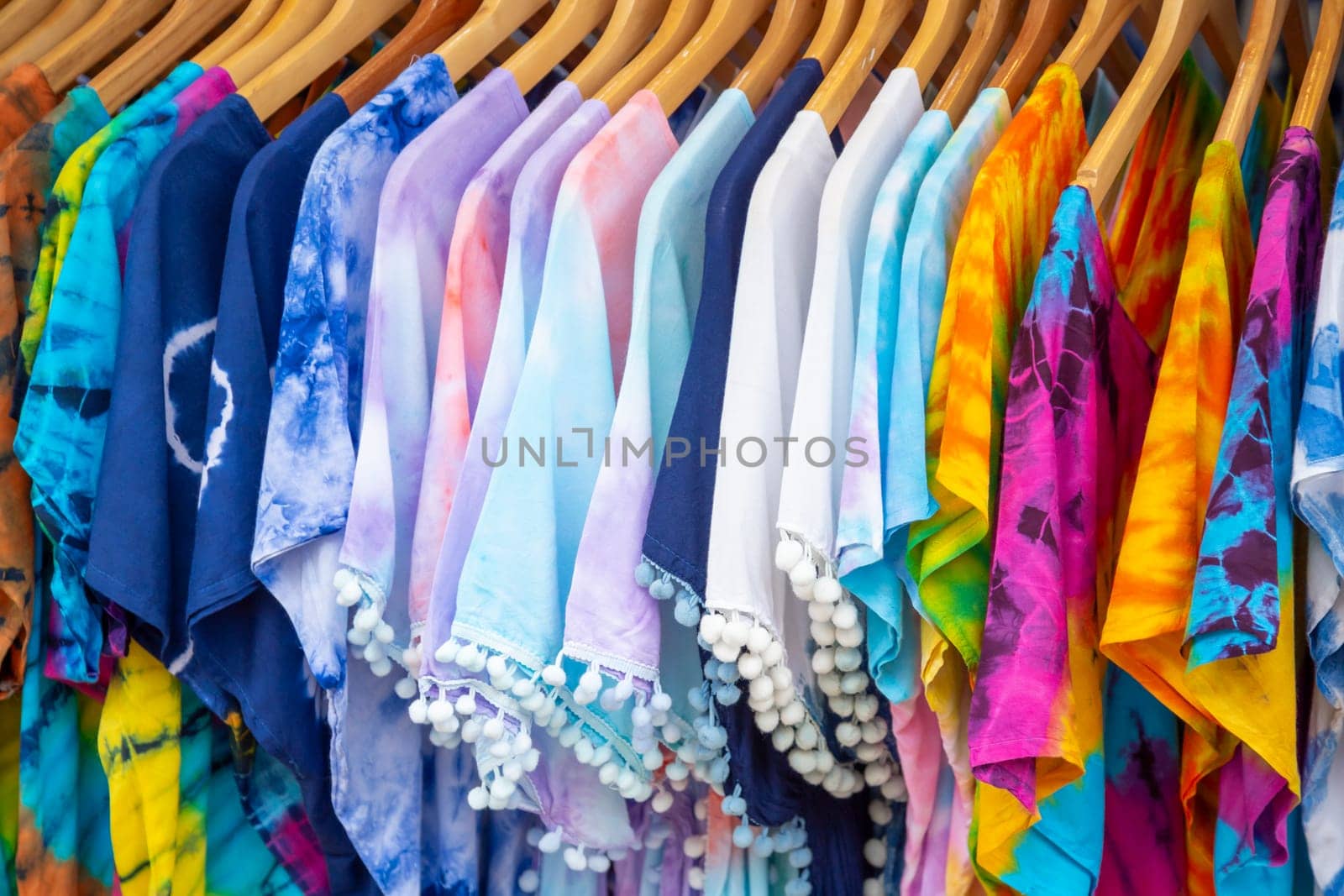 The Beautiful patterned on the Thai style garment, batik and clothing for sale at the local market. by Gamjai