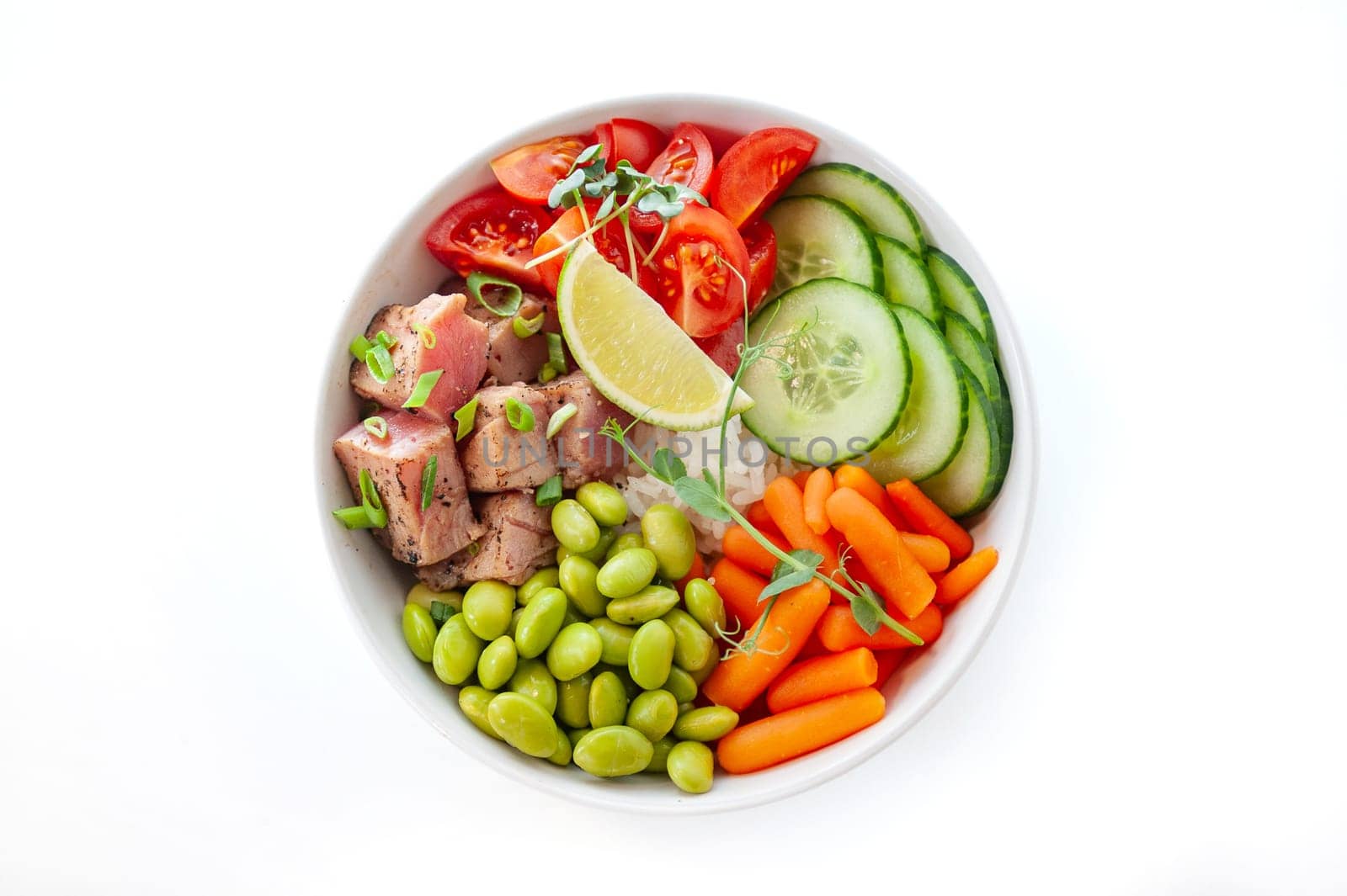Poke bowl with tuna isolated on white background. Top view. High quality photo
