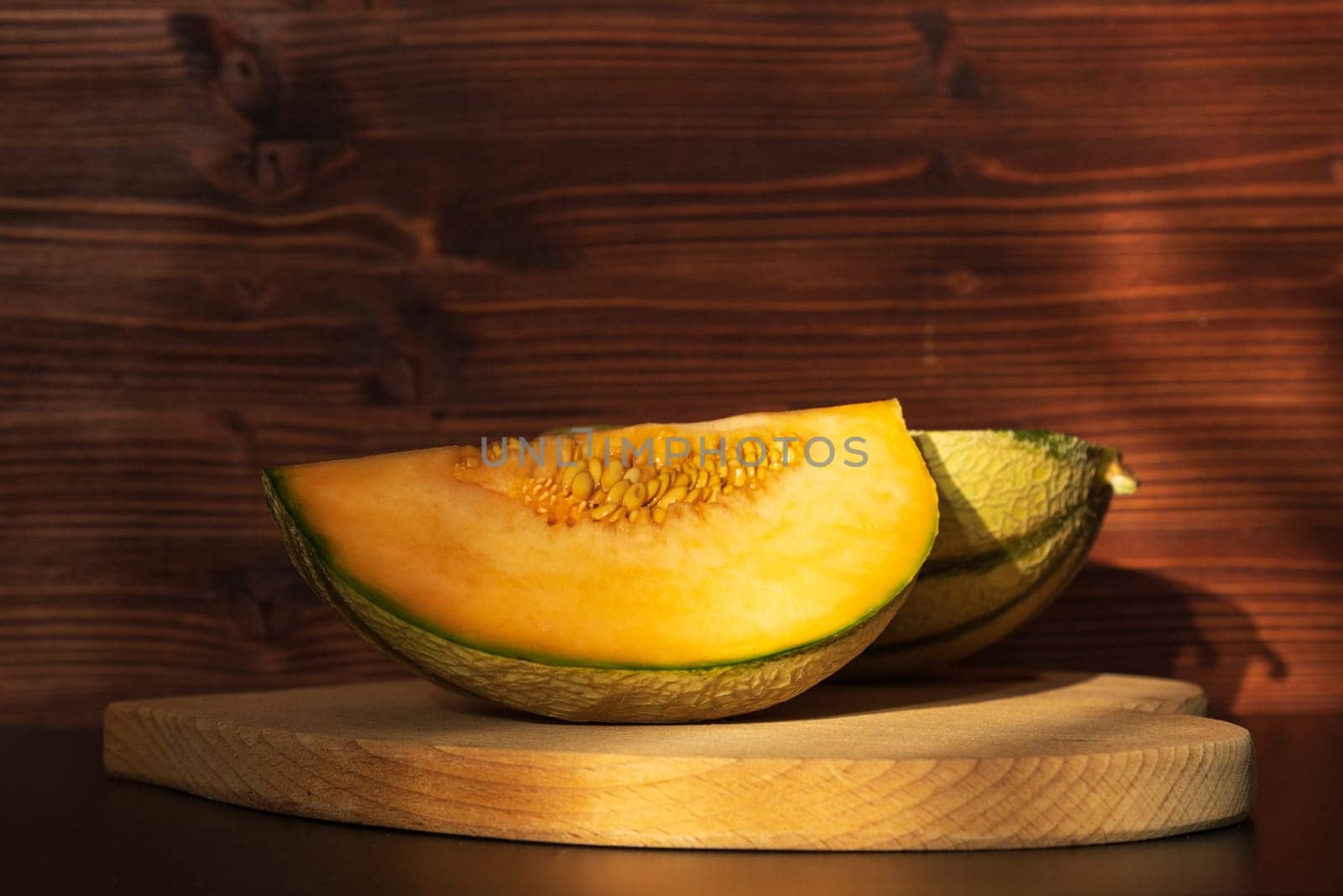 Orange melon harvested in the greenhouse of an organic fruit farm. Favorite fruits in summer.