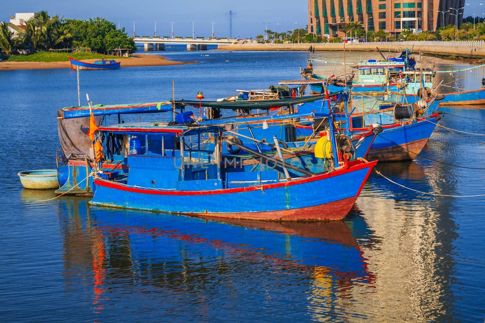 Traditional fishing boats near the colorful fishing port in Nha Trang, Vietnam.