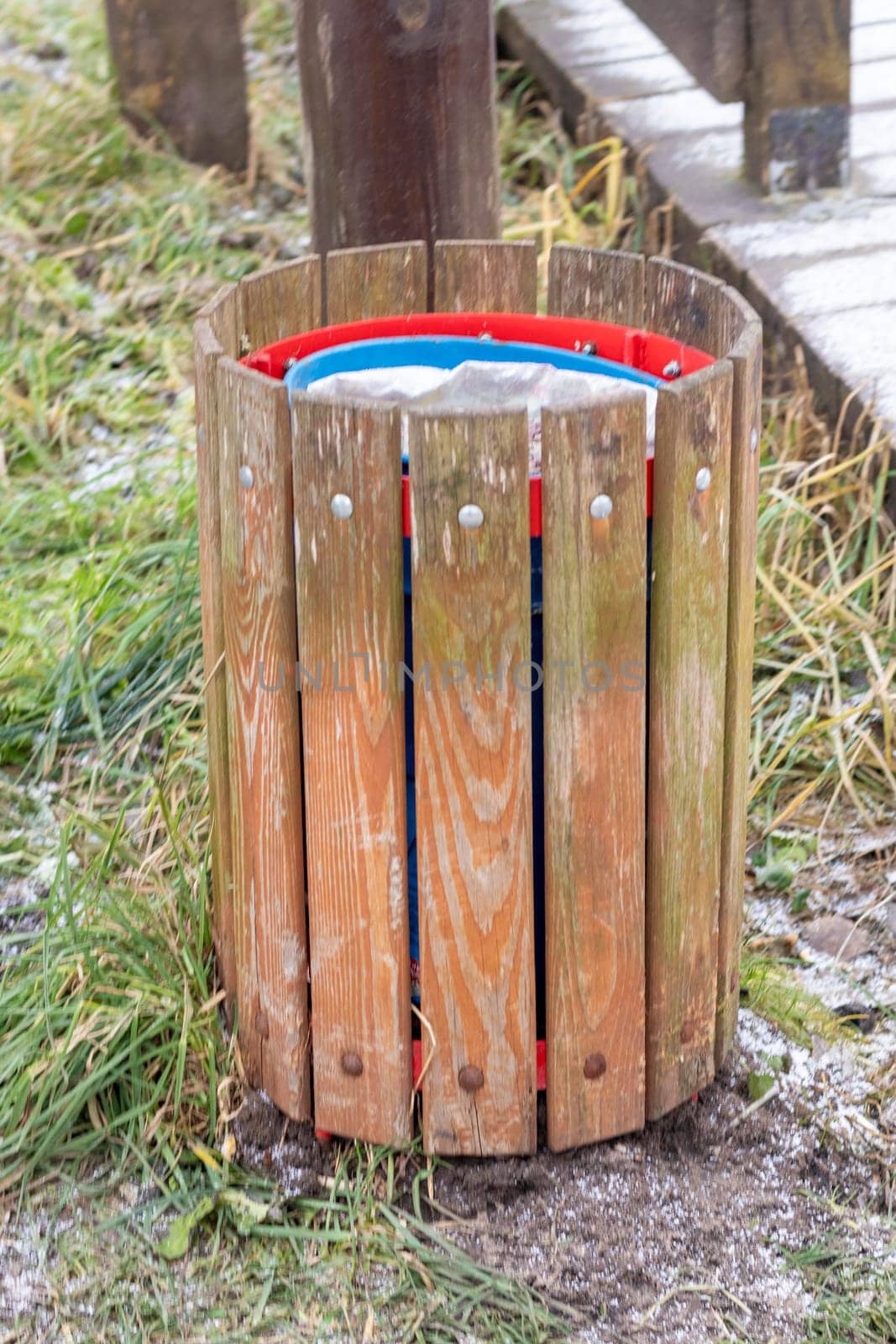 Shot of the trash bin by the bench in the park