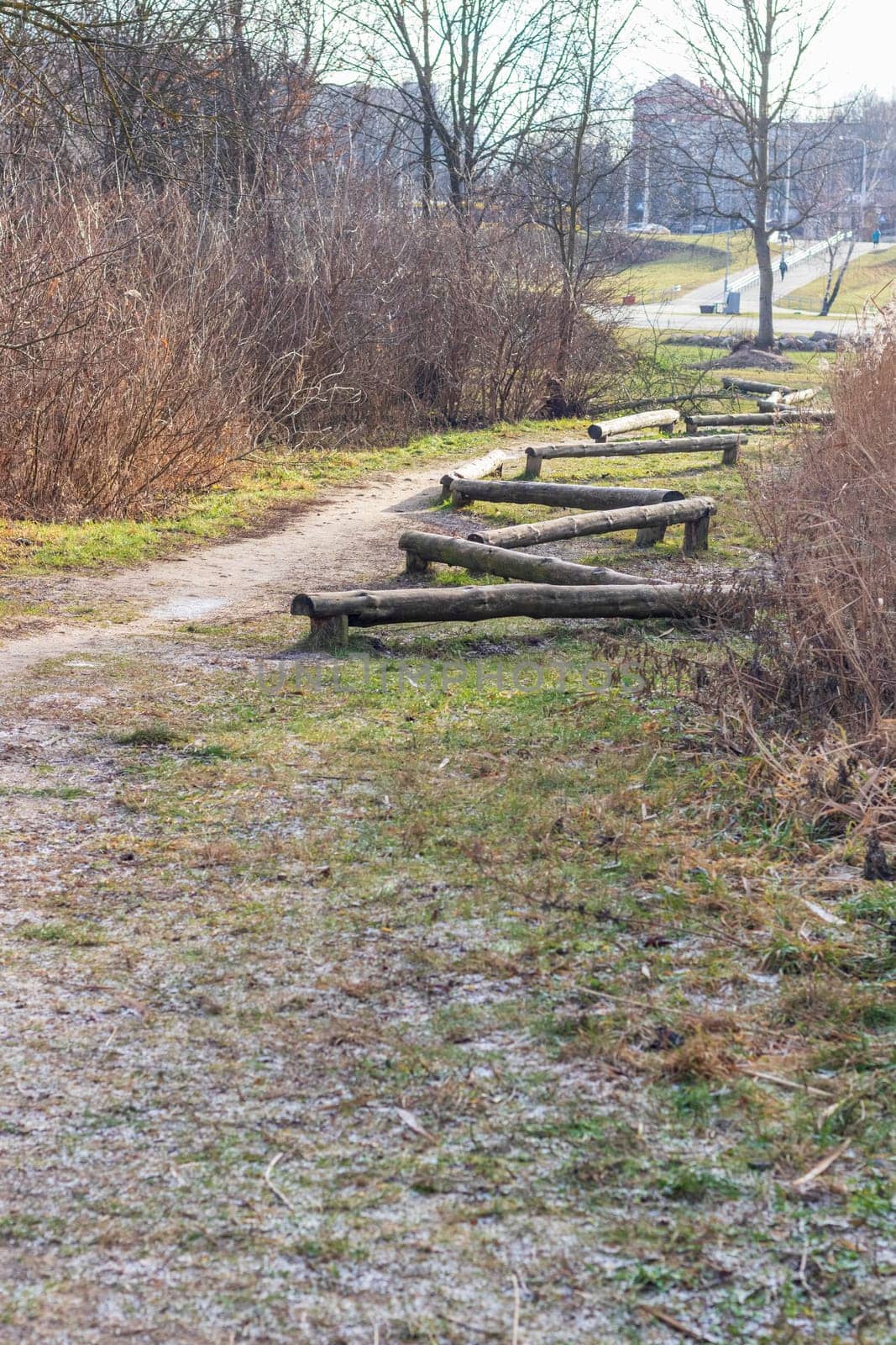 Wooden logs as a element of physical exercise equipment in the park