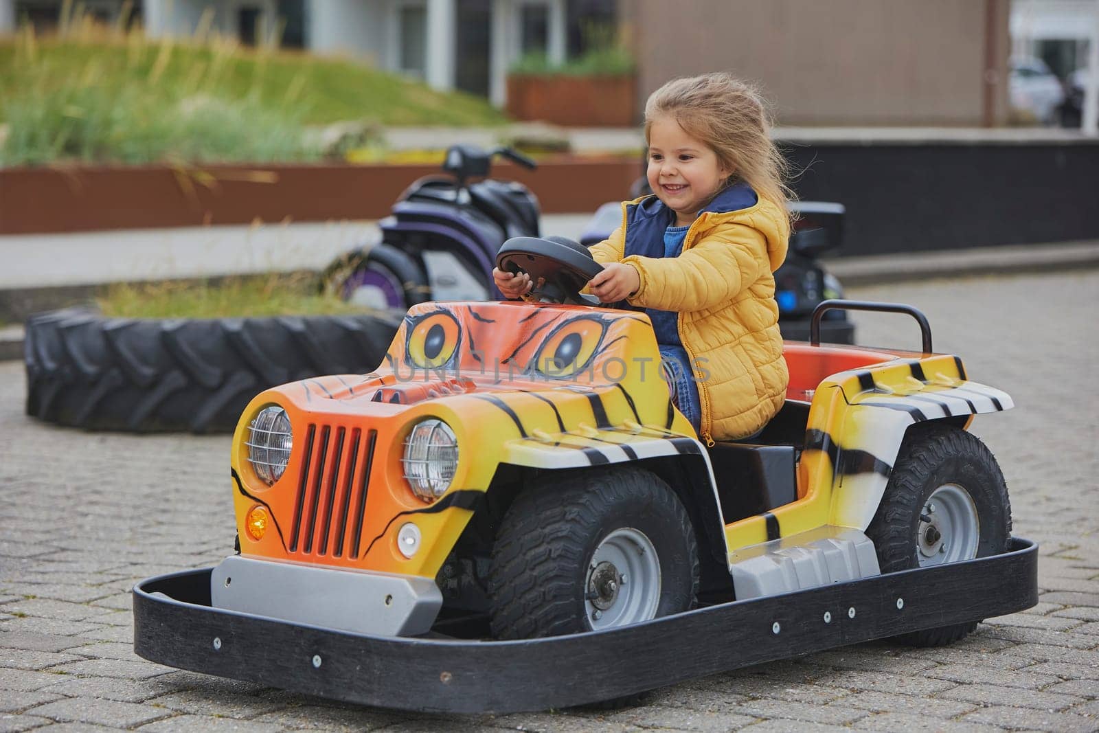 cute child playing in an amusement park in Denmark.