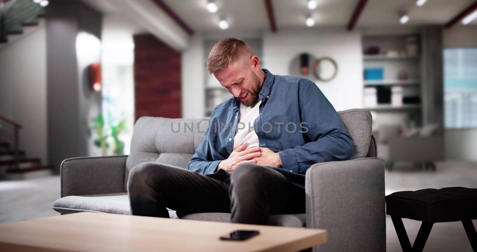 Man With Heartburn And Nausea From Eating Fastfood
