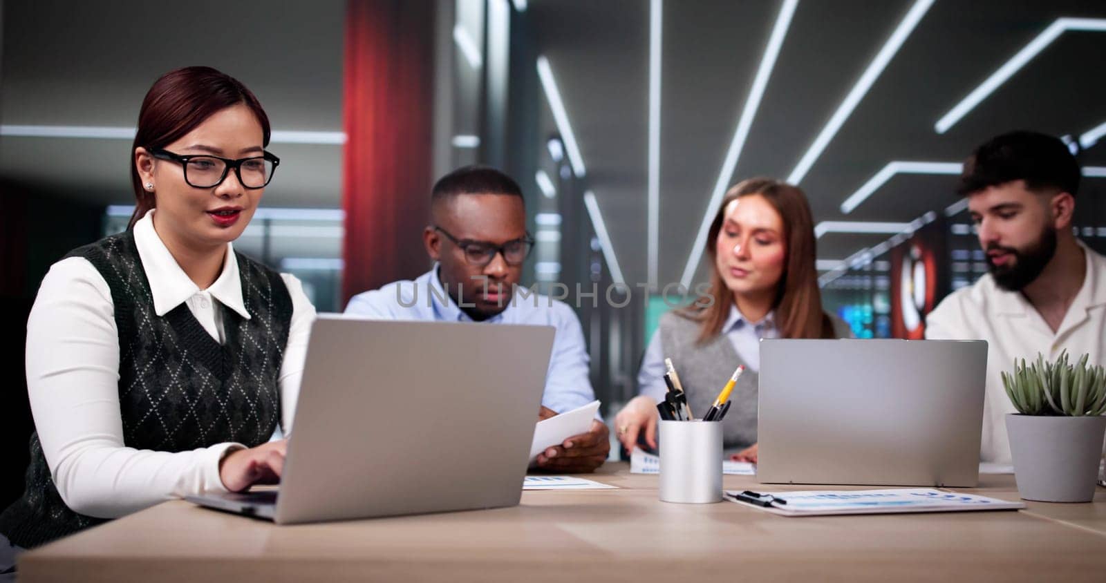 Predictive Business Analytics On Laptop Computer. Group Of Analysts
