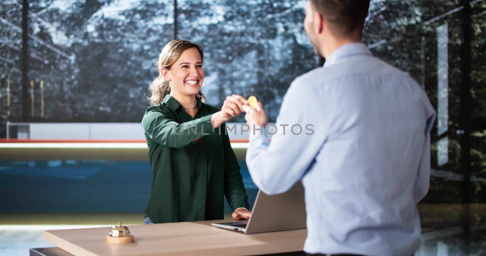 Man At Hotel Talking To Receptionist Woman. Travel Vacation Lifestyle