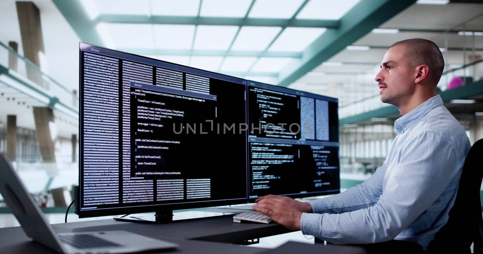 Web Developer Coding On Computer